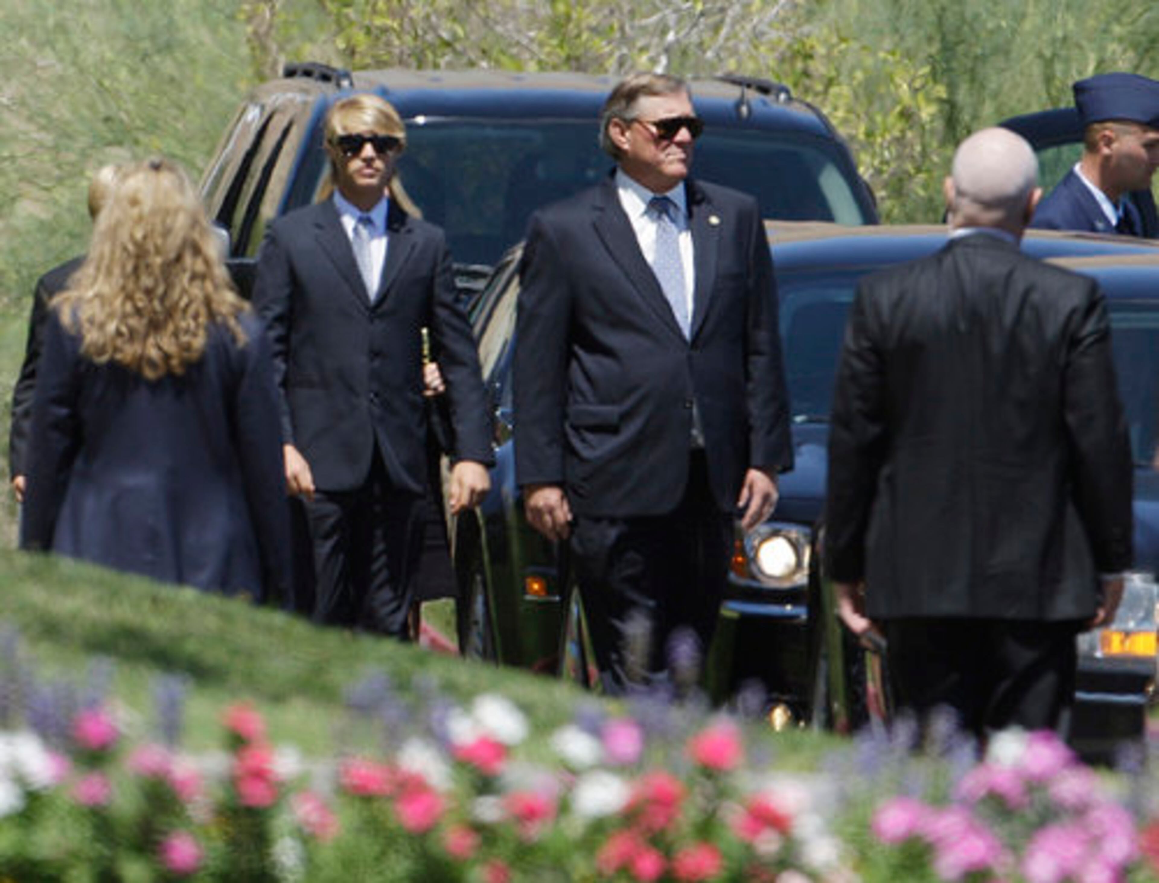Jack Ford, facing camera at right, arrives for the funeral of his mother, Betty.
