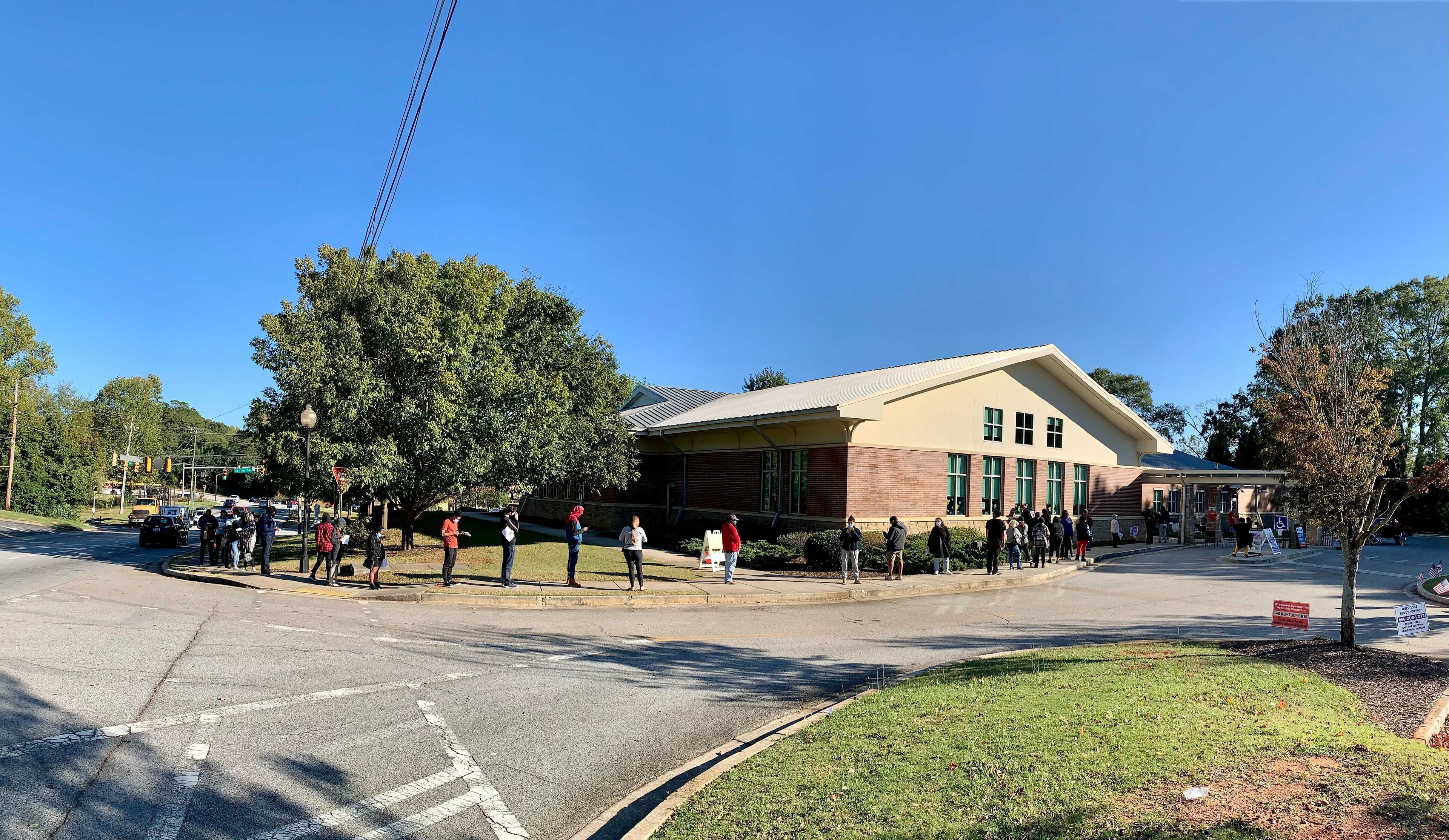 Voters wait to cast their ballots at the South Cobb Regional Library Friday afternoon. (HENRI HOLLIS/AJC)