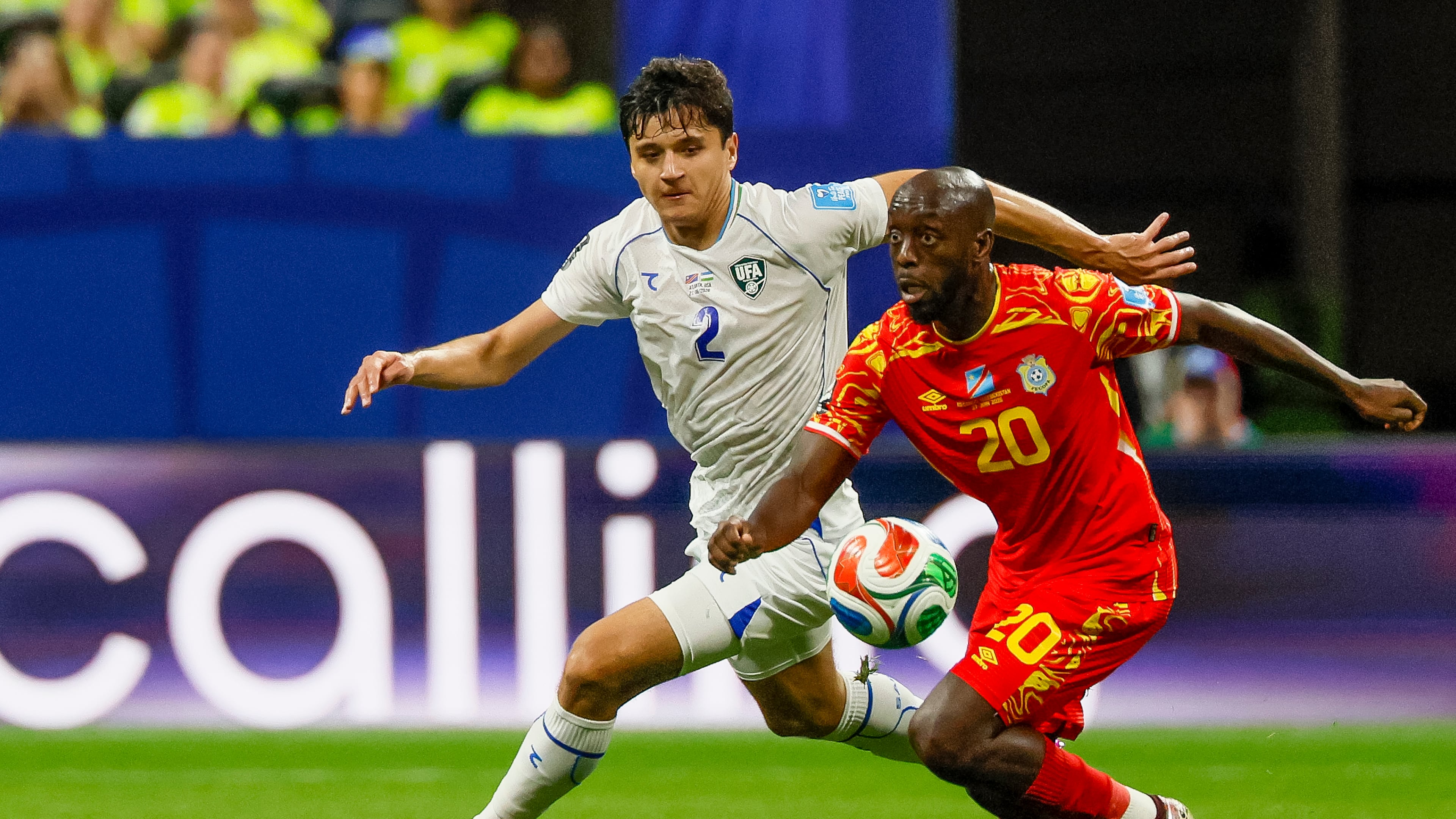 Uzbekistan defender Abdukodir Khusanov (left) chases Congo forward Yoane Wissa (right) across midfield during the first half of a FIFA World Cup match at Atlanta Stadium (Mercedes-Benz Stadium) on Saturday, June 27, 2026, in Atlanta. (Miguel Martinez/AJC)