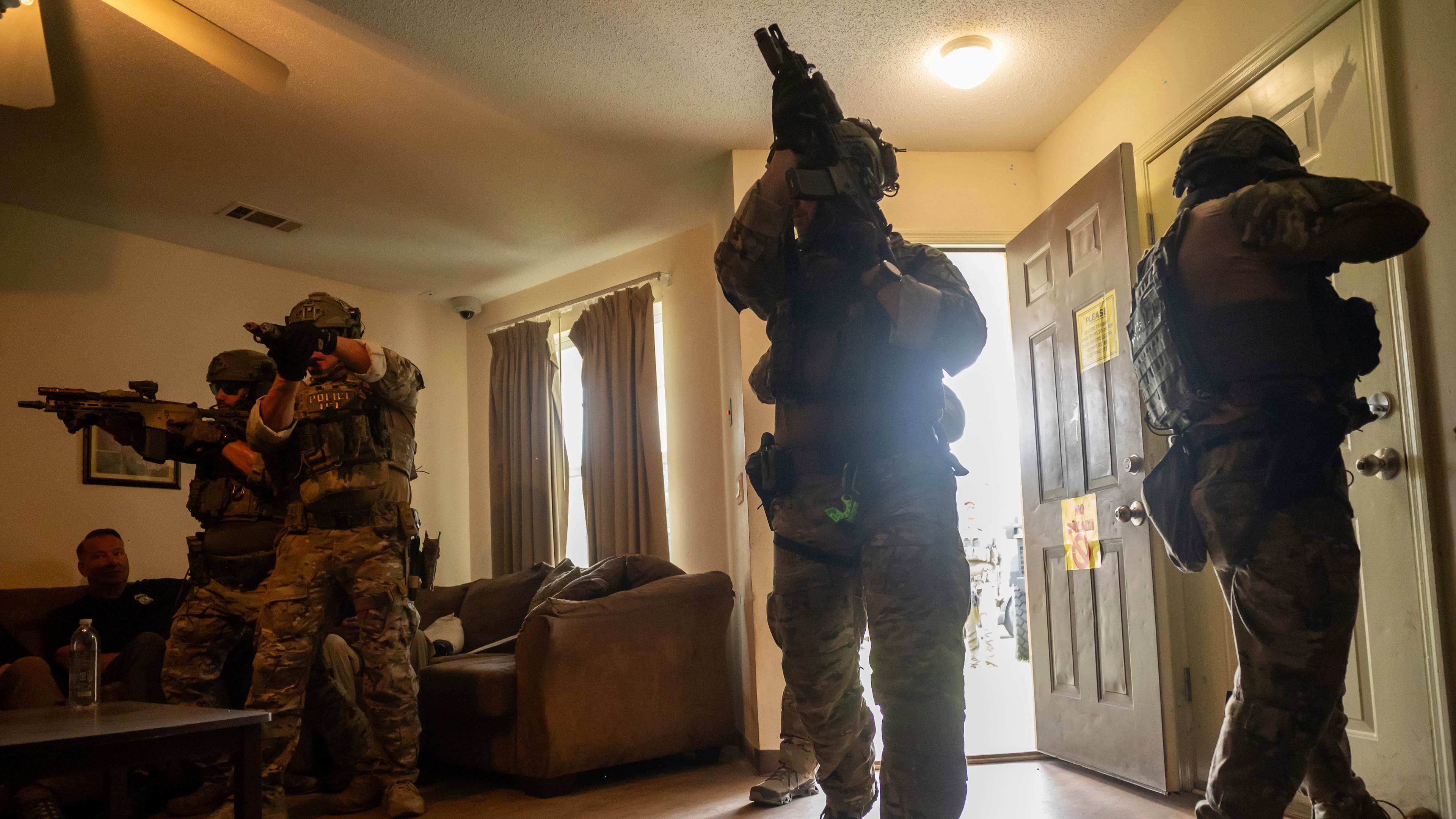Immigration and Customs Enforcement Special Response Team members demonstrate how they are trained at the Federal Law Enforcement Training Centers in Brunswick. FLETC is the primary education hub for 105 federal agencies and is the base for the Department of Homeland Security’s Surge Operations Training Center, created last fall for ICE agents and others involved in deportation. (Fran Ruchalski/AP 2025)