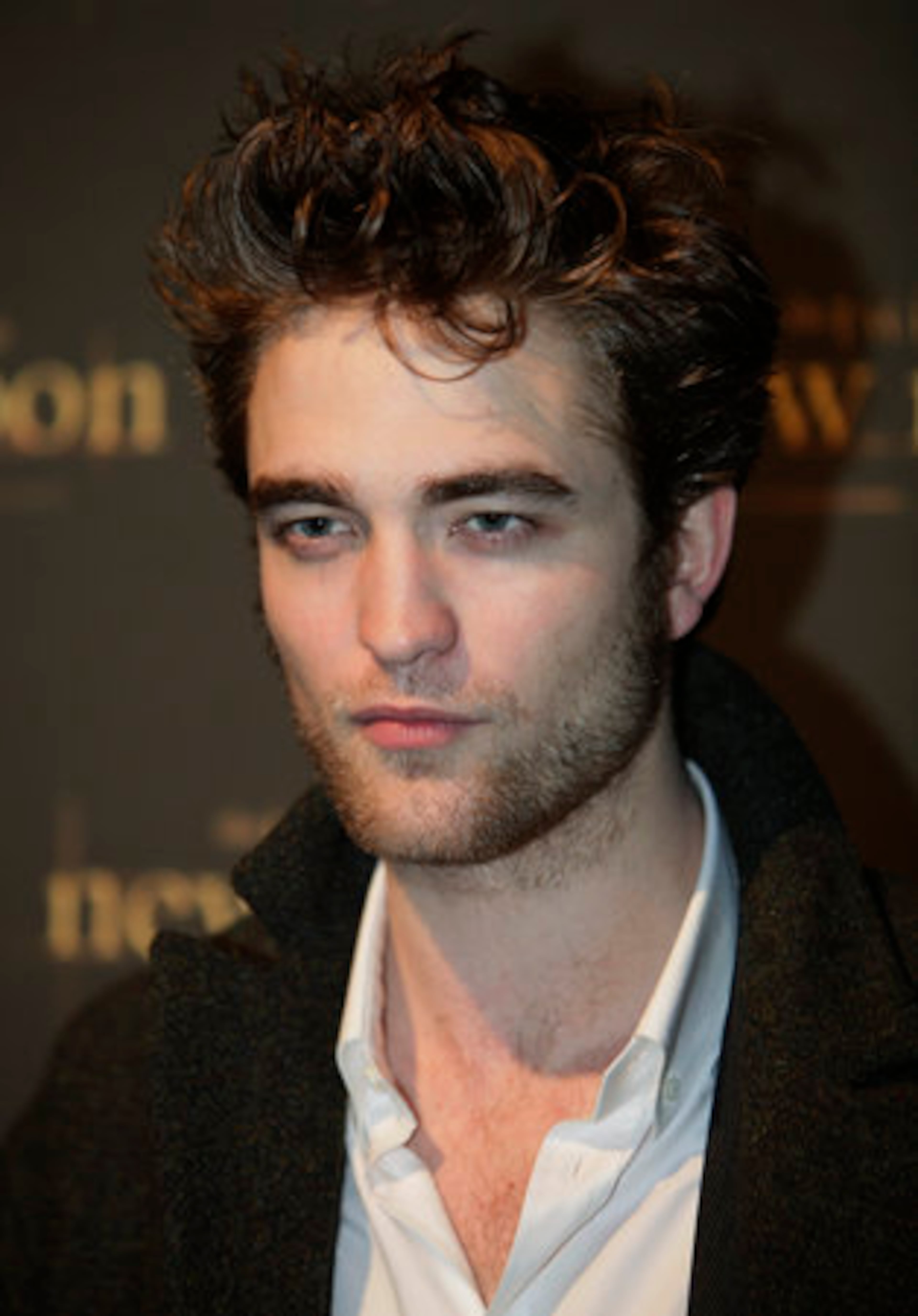 British actor Robert Pattinson poses prior to the UK fan party. It's taken a little over a year for him to be considered a staple heartthrob worldwide.