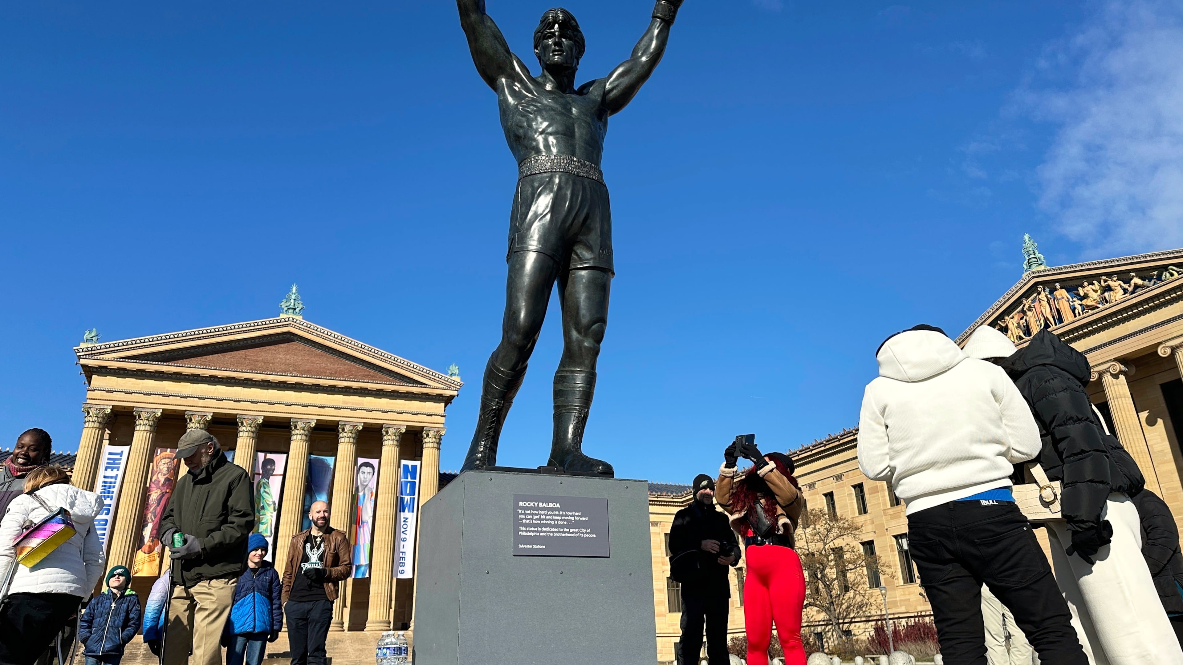 FILE - Visitors gather around the Rocky Statue during RockyFest 2024 at the Philadelphia Museum of Art, Dec. 3, 2024, in Philadelphia. (AP Photo/Tassanee Vejpongsa, File)