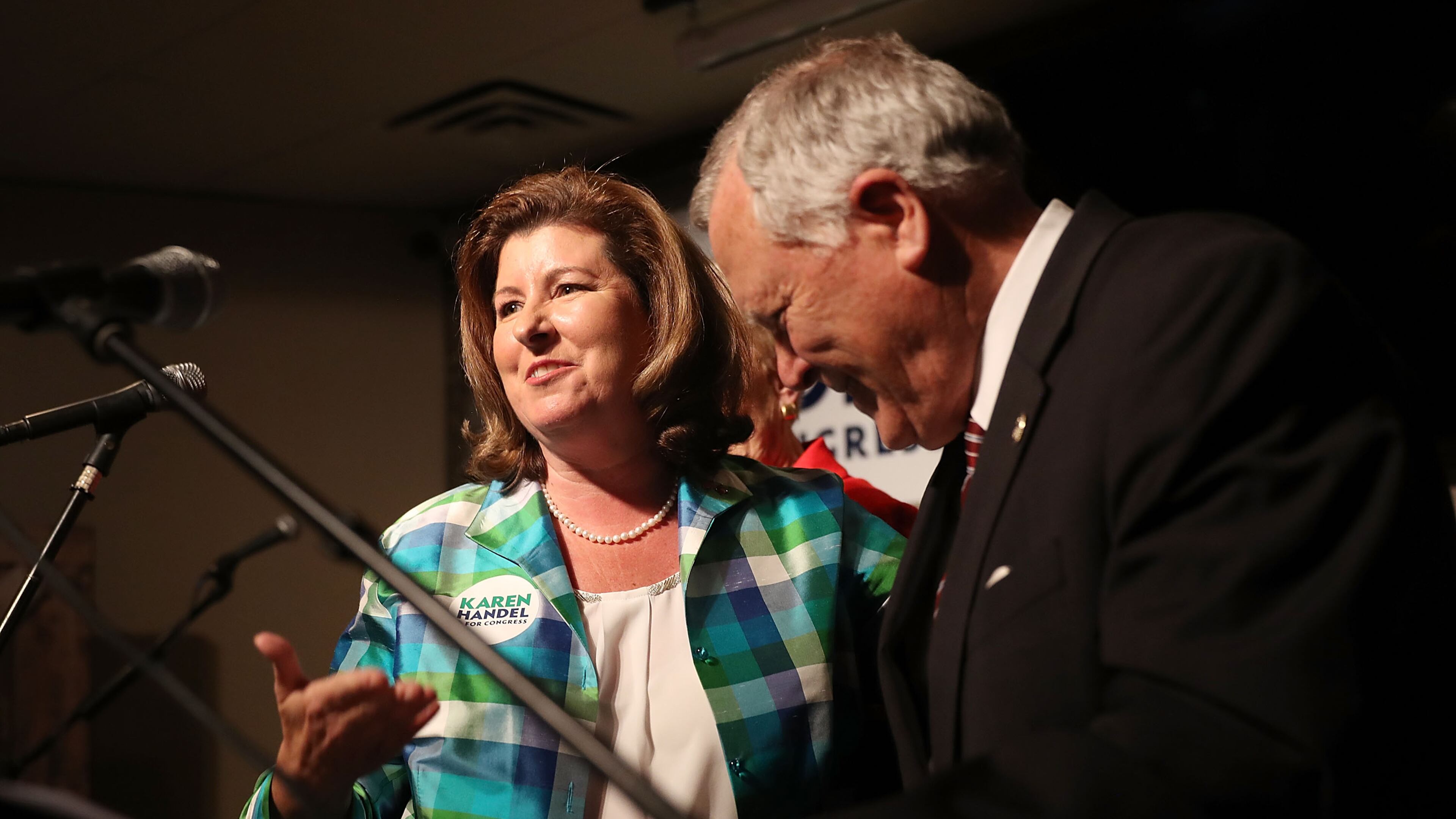 Republican candidate Karen Handel stands with Georgia Governor Nathan Deal as he introduces her to speak during a campaign stop at Houck's Grille in Roswell, Ga. on June 19, 2017. (Photo by Joe Raedle/Getty Images)