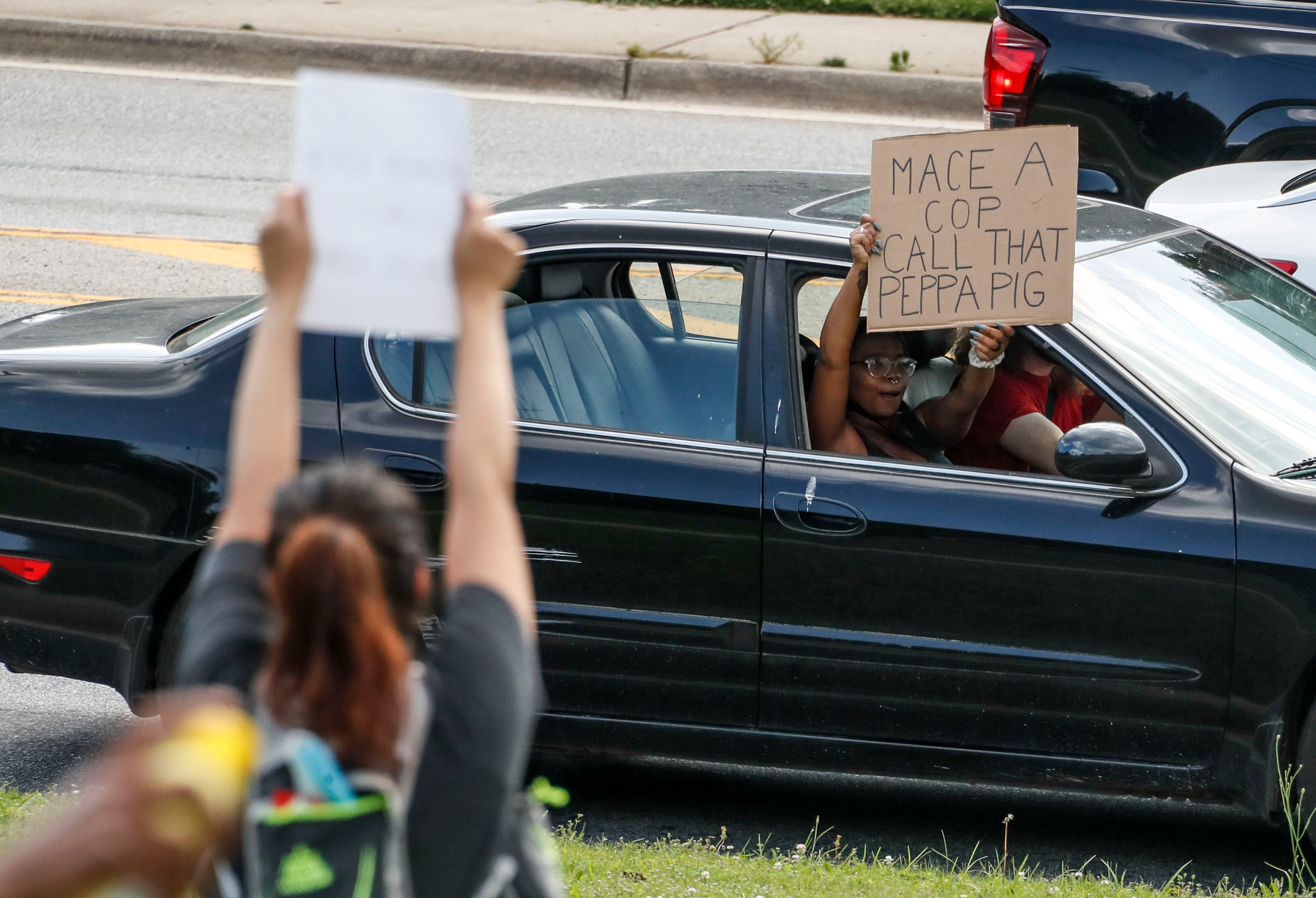 6/2/20 - Atlanta - Car horns blared in support as several hundred protestors gathered at Freedom Park in Atlanta, and marched down Freedom Trail to the BeltLine. Bob Andres / bandres@ajc.com