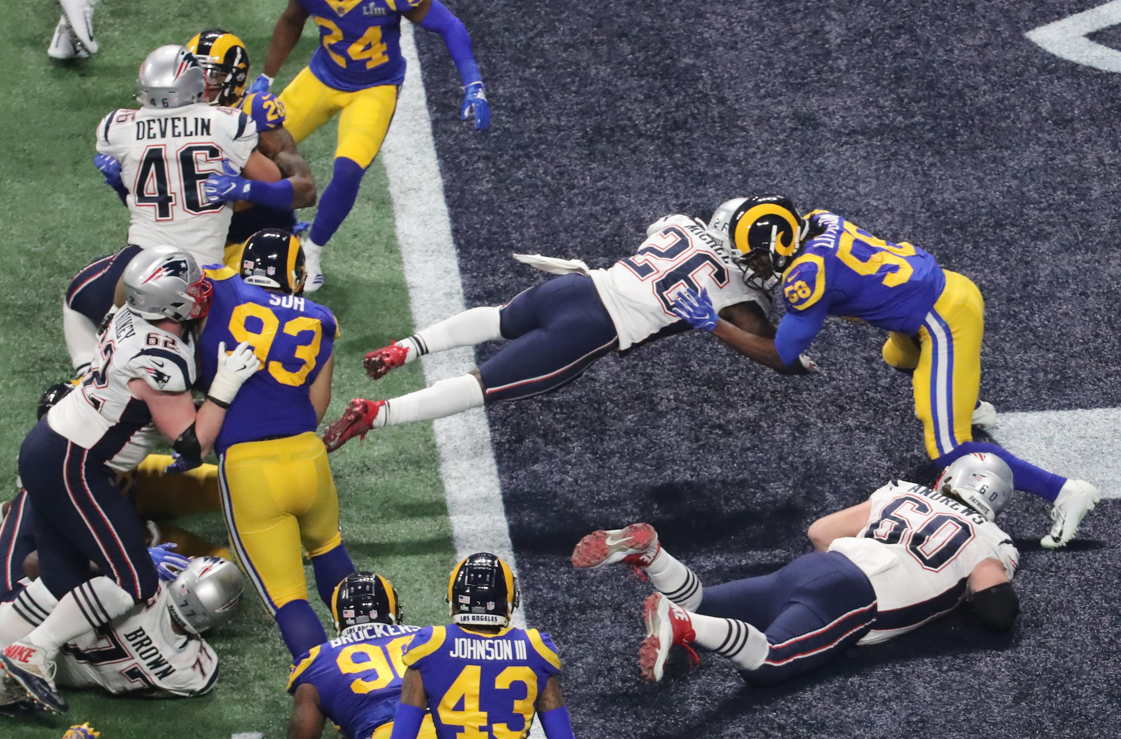 2/3/19 - Atlanta - New England Patriots running back Sony Michel (26) rushes for a fourth quarter touchdown to take the lead over the Los Angeles Rams on Sunday, Feb. 3, 2019 during Super Bowl LIII at Mercedes-Benz Stadium in Atlanta, Ga. 
JOHN SPINK/JSPINK@AJC.COM

