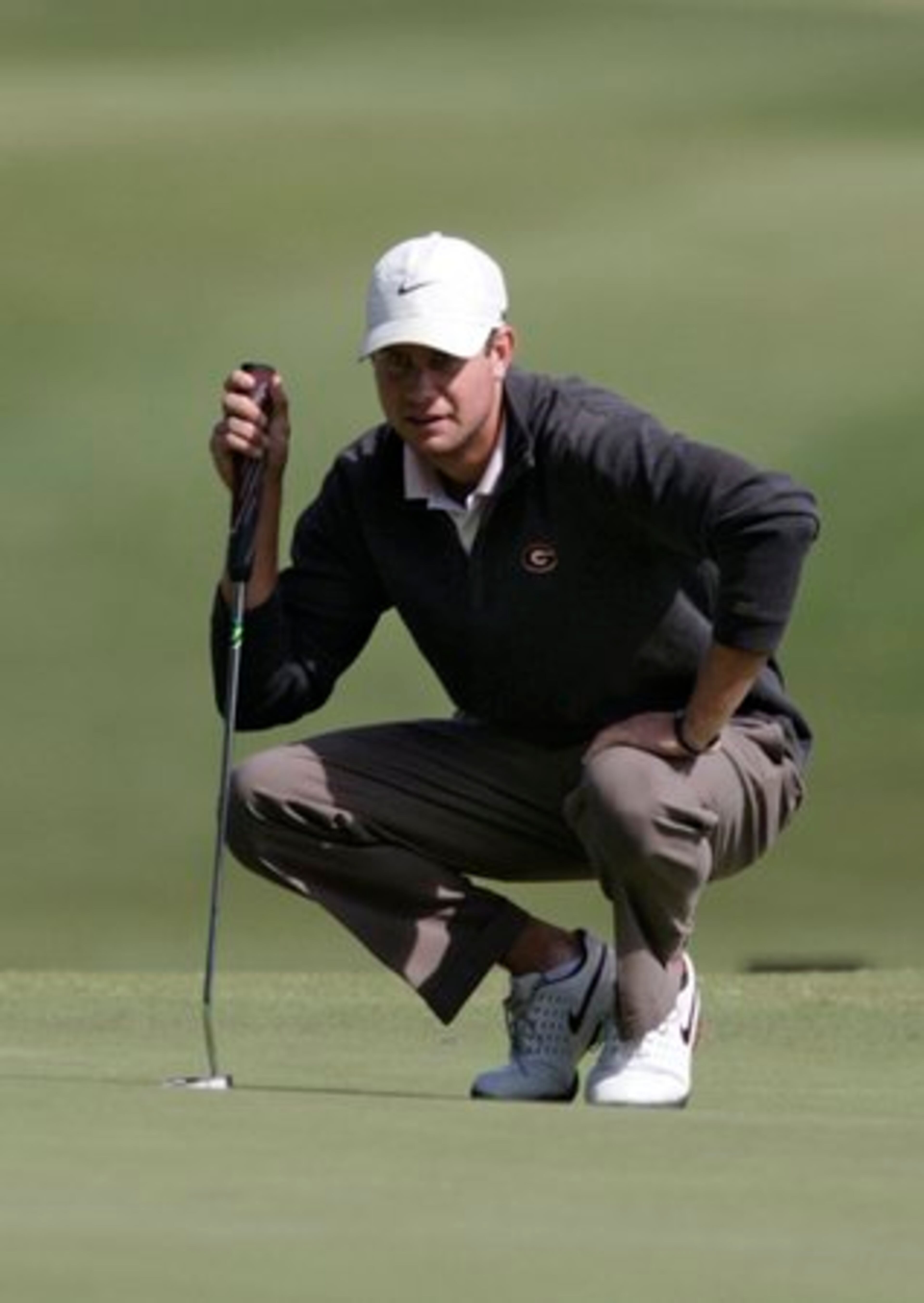 UGA's Harris English lines up his putt on 14. John Smoltz was among those trying to qualify for the U.S. Open in a qualifying tournament in Suwanee today. Tuesday May 17, 2011