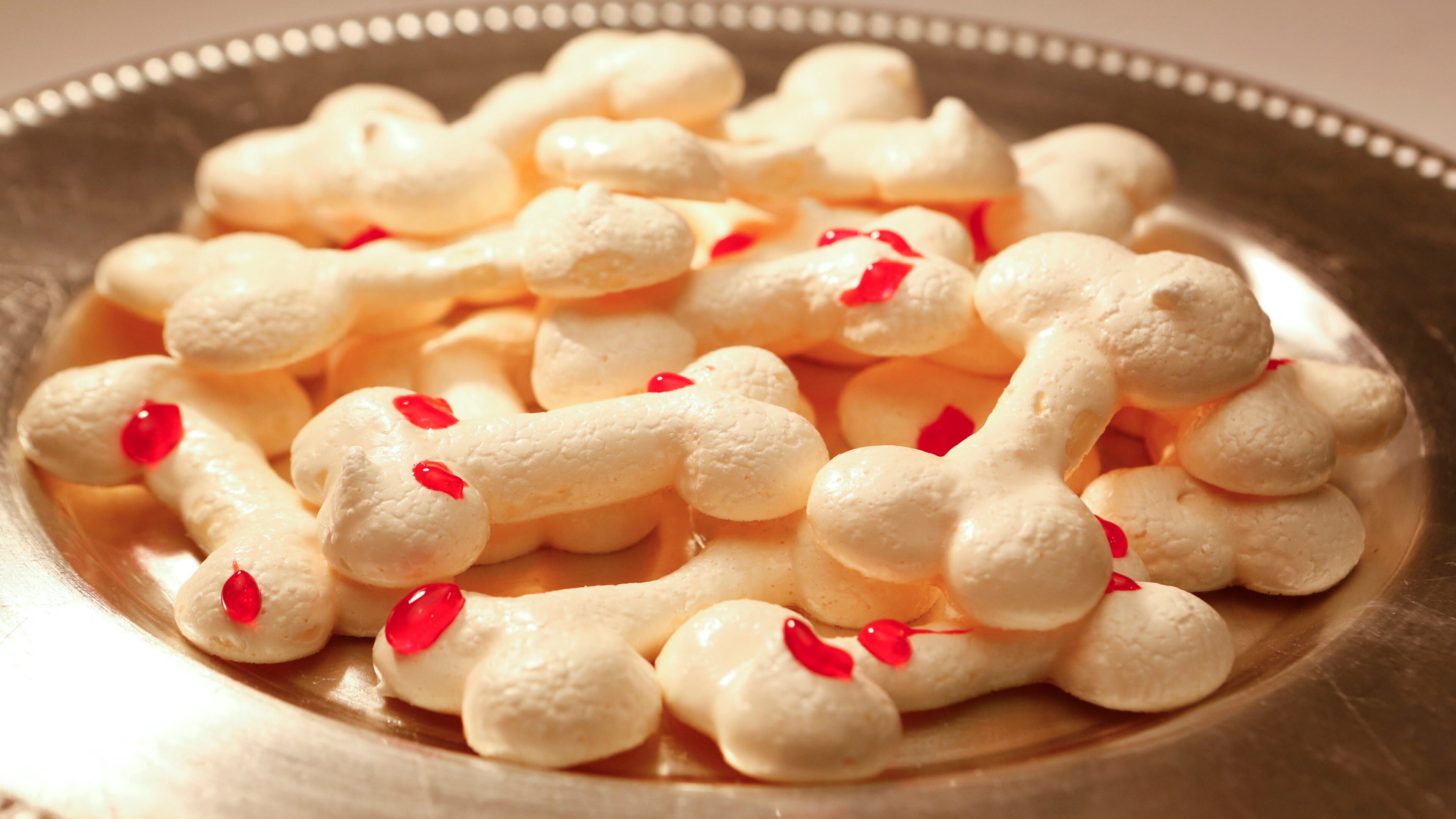 Make a stiff meringue, then pipe into whatever shape you desire -- bones are a perfectly crunchy choice for Halloween. Pipe them and then give them plenty of time to dry in a warm oven before decorating with red food gel or strawberry jam "blood." (Anne Cusack/Los Angeles Times/MCT)