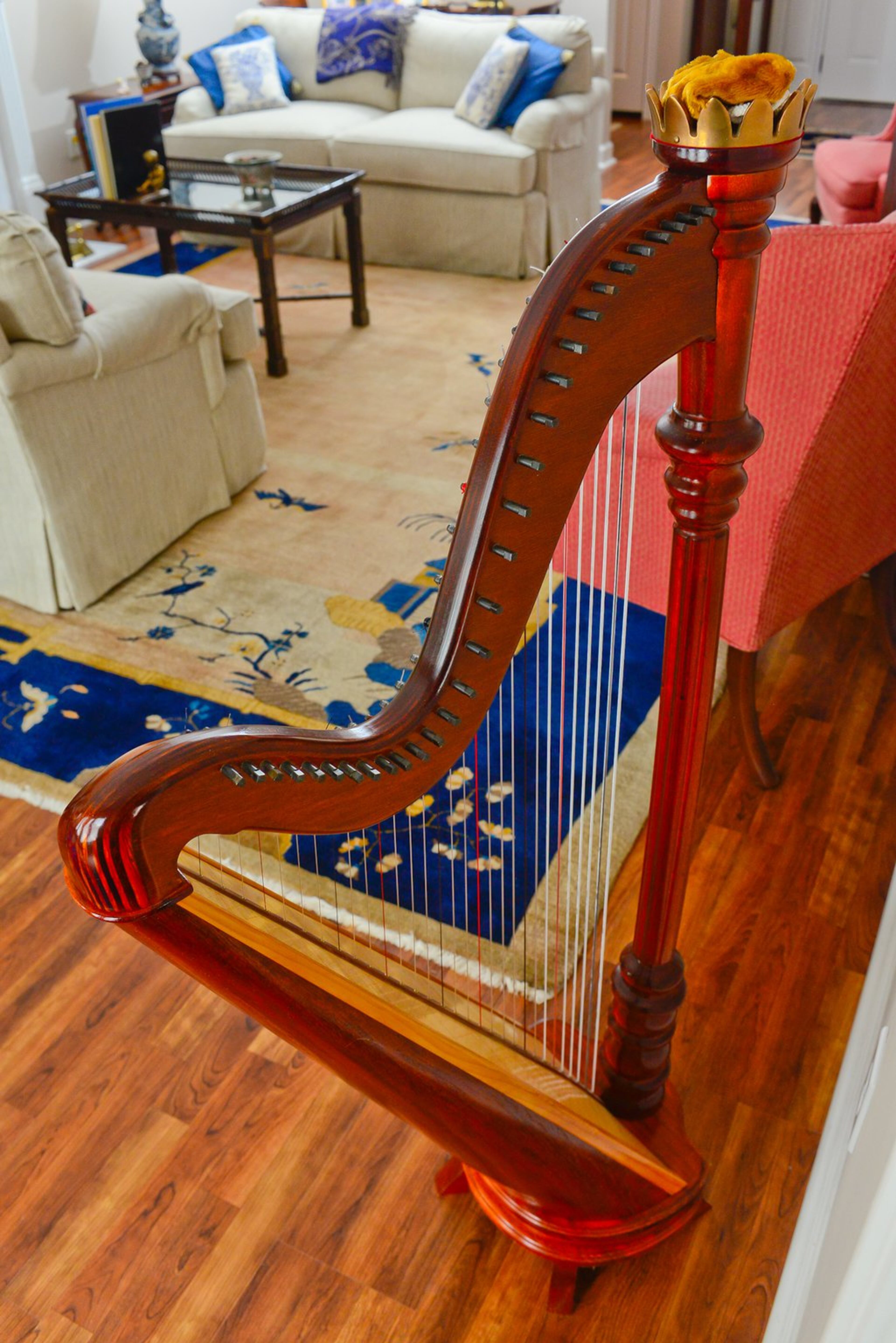 A folk harp, made by artist James Martin in Australia, sits in the living room. It was an anniversary gift from Chris to Linda, who takes harp lessons. "I love it, because I love harp music. I'm always so thrilled with the symphony when I see two or three harps up there," said Linda.