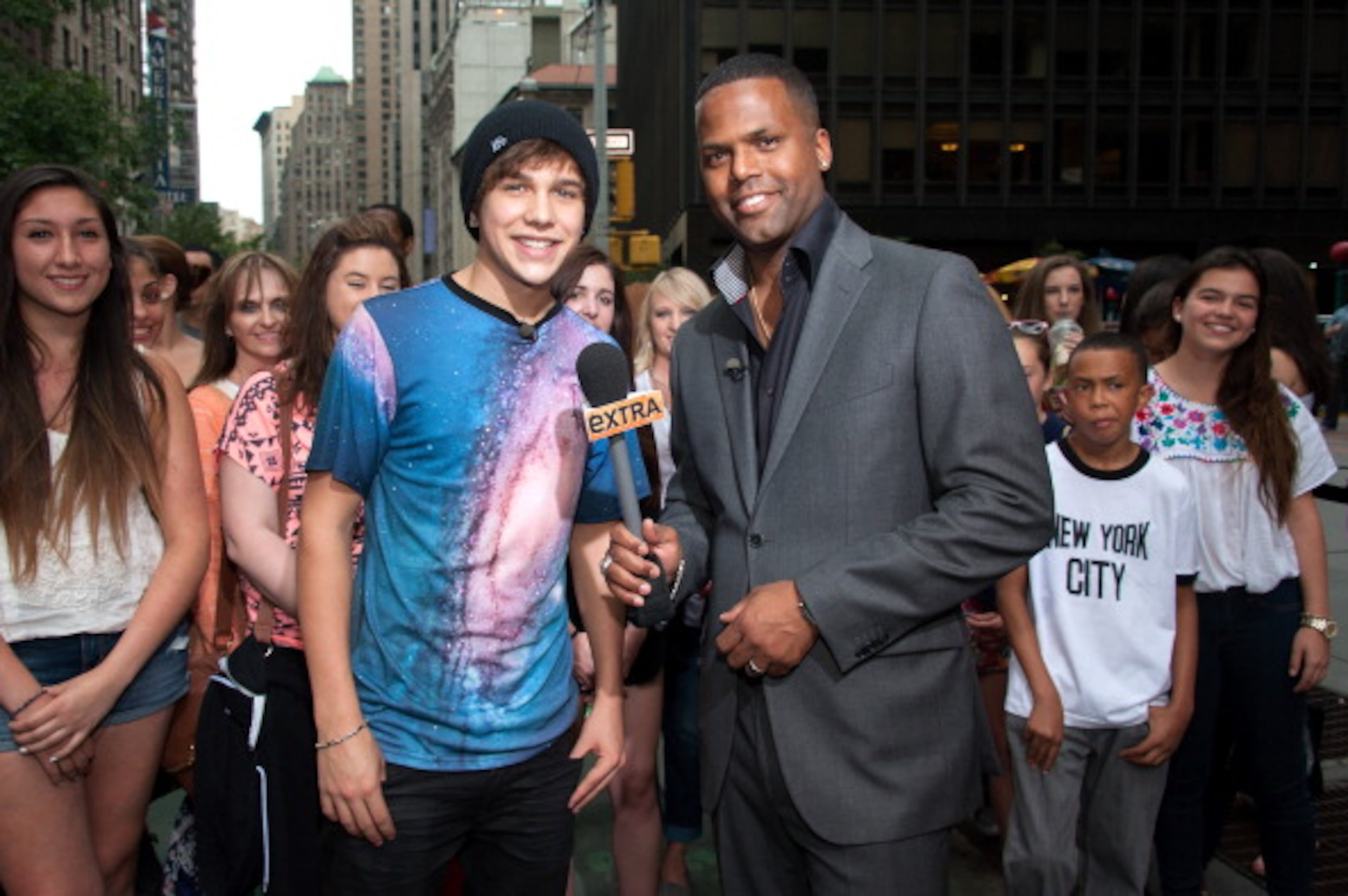 NEW YORK, NY - JUNE 11: AJ Calloway (R) interviews Austin Mahone during his visit to "Extra" in Times Square on June 11, 2013 in New York City. (Photo by D Dipasupil/Getty Images for Extra)