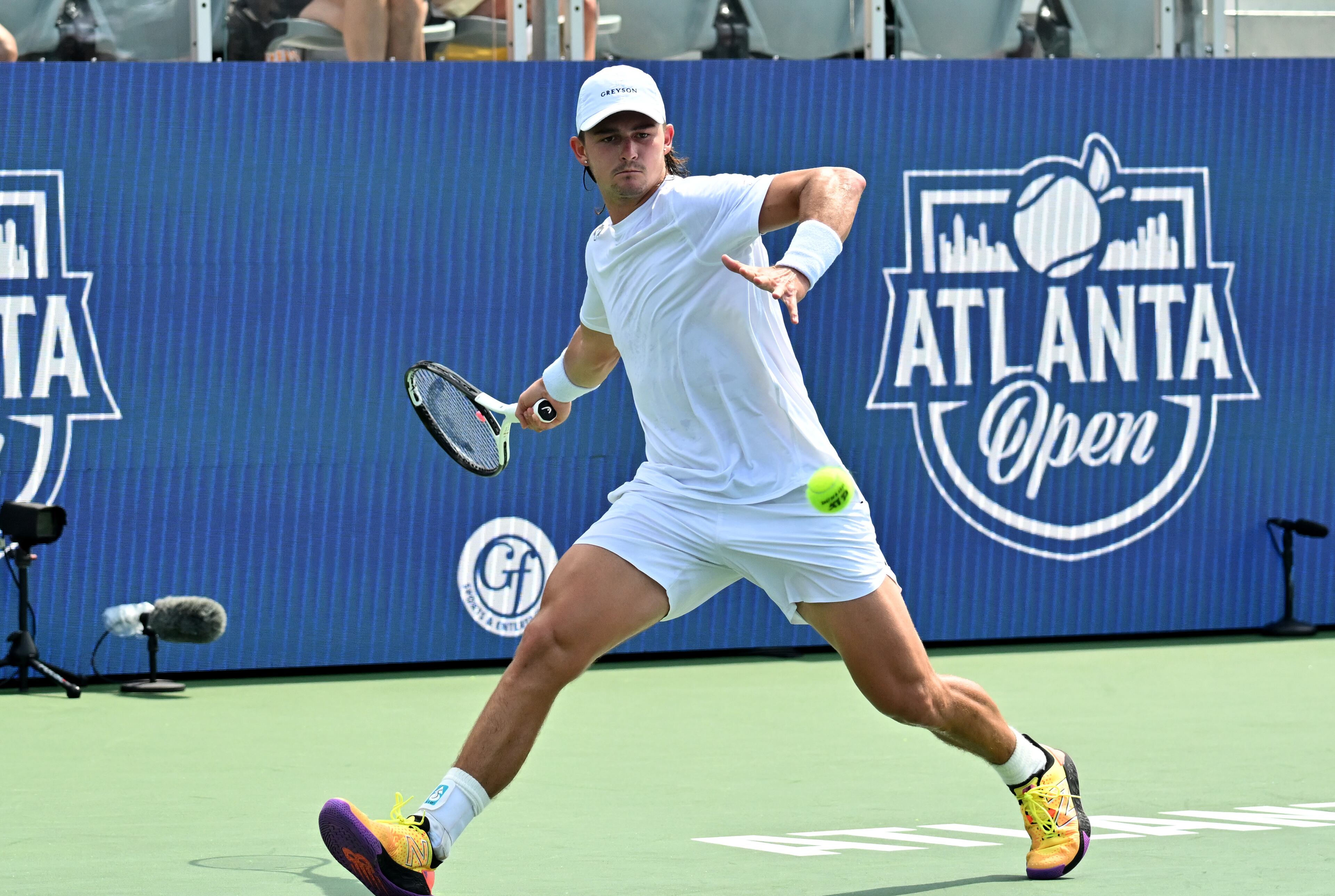 J.J. Wolf returns the ball to Taylor Fritz during a semifinal match at the 2023 Atlanta Tennis Open at Atlantic Station, Saturday, July 29, 2023, in Atlanta. (Hyosub Shin / Hyosub.Shin@ajc.com)