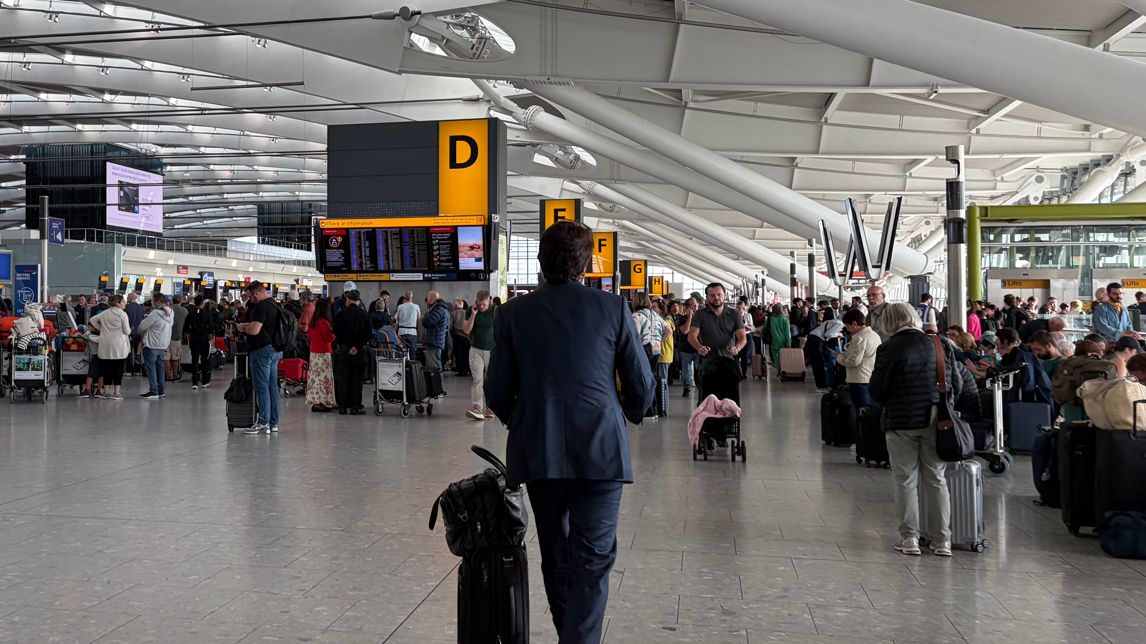 Passengers walk through Terminal 5 of London Heathrow Airport after flights were cancelled because of a technical issue in Britain's air traffic control system Tuesday, Sept. 8, 2026, in London. (Ellie Crabbe/PA via AP)