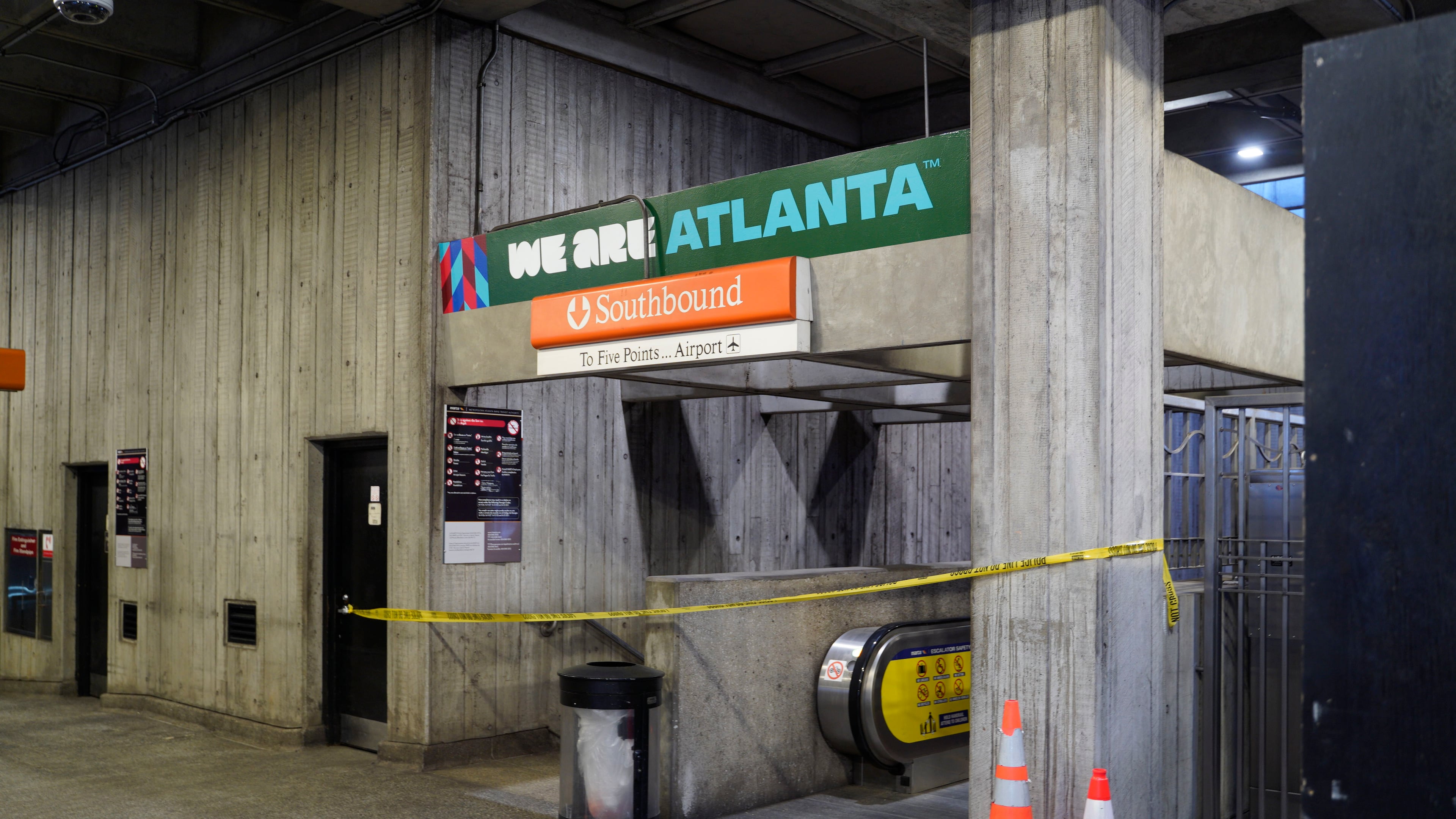 Crime scene tape stretches across an escalator at MARTA's Midtown station following a shooting Friday, June 5, 2026. (Ben Hendren for the AJC)