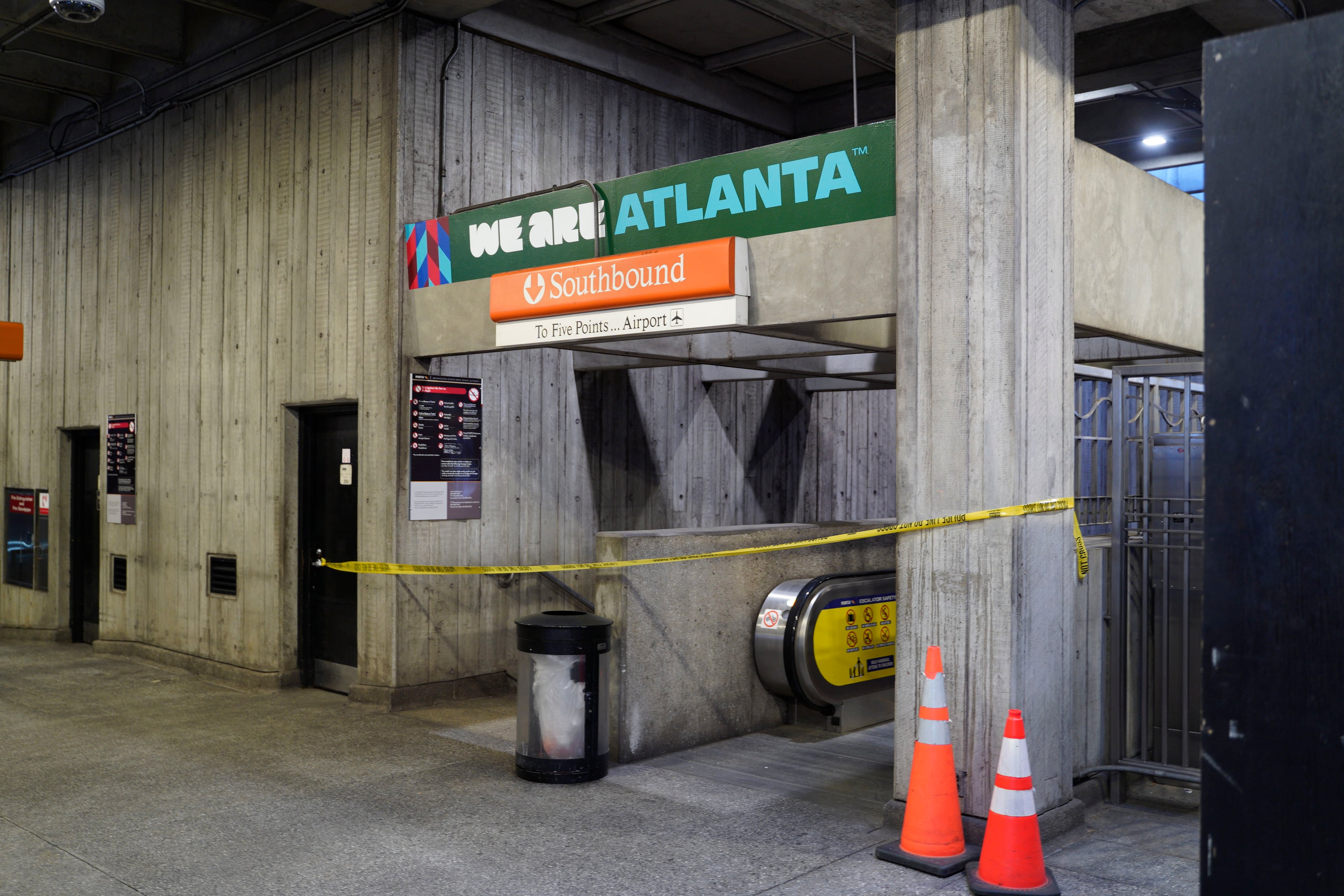 Crime scene tape stretches across an escalator at MARTA's Midtown station following a shooting Friday, June 5, 2026. (Ben Hendren for the AJC)