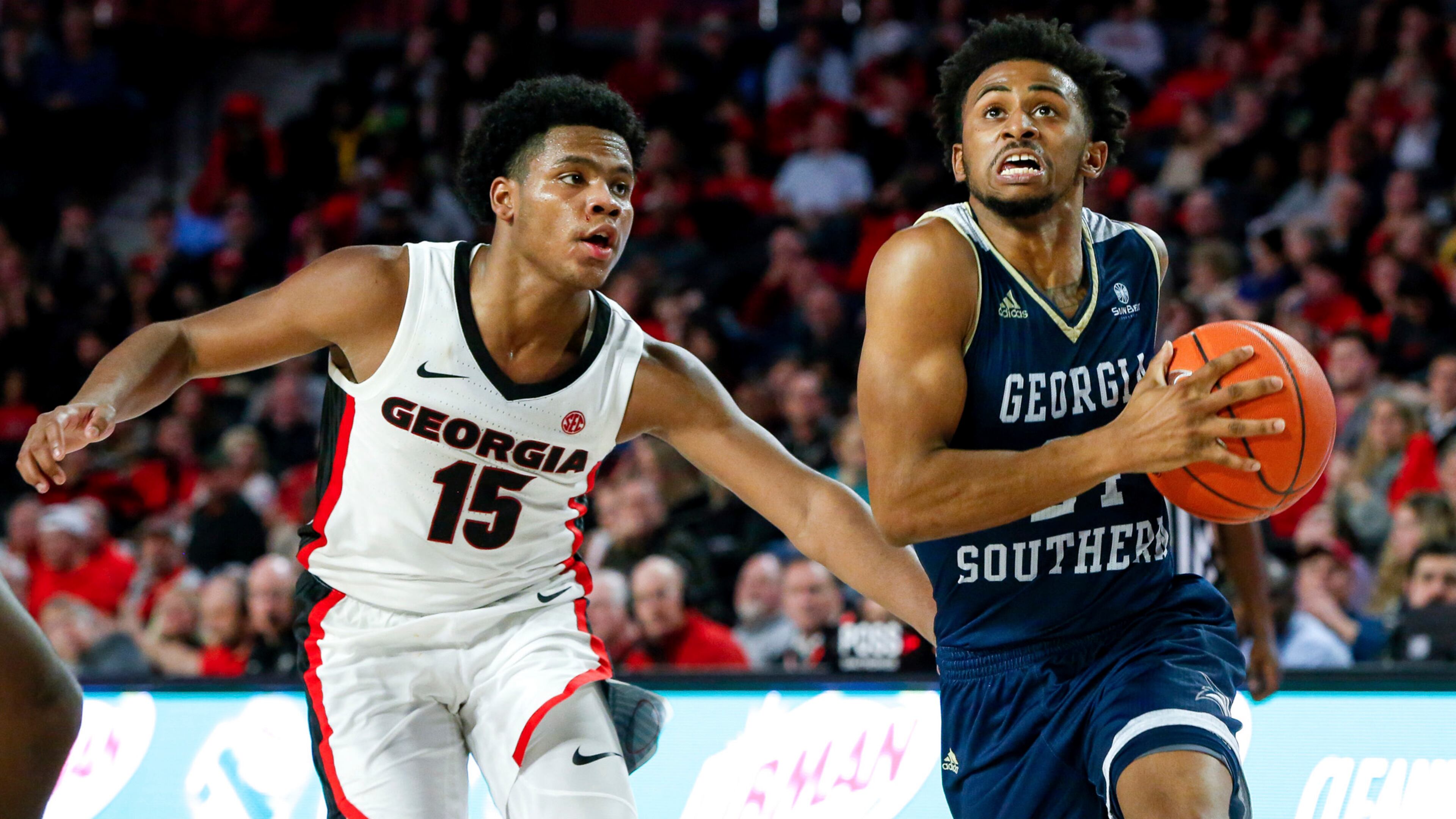 Georgia Southern's David-Lee Jones Jr. (24) drives to the basket as Georgia's Sahvir Wheeler defends Monday, Dec. 23, 2019, in Athens.