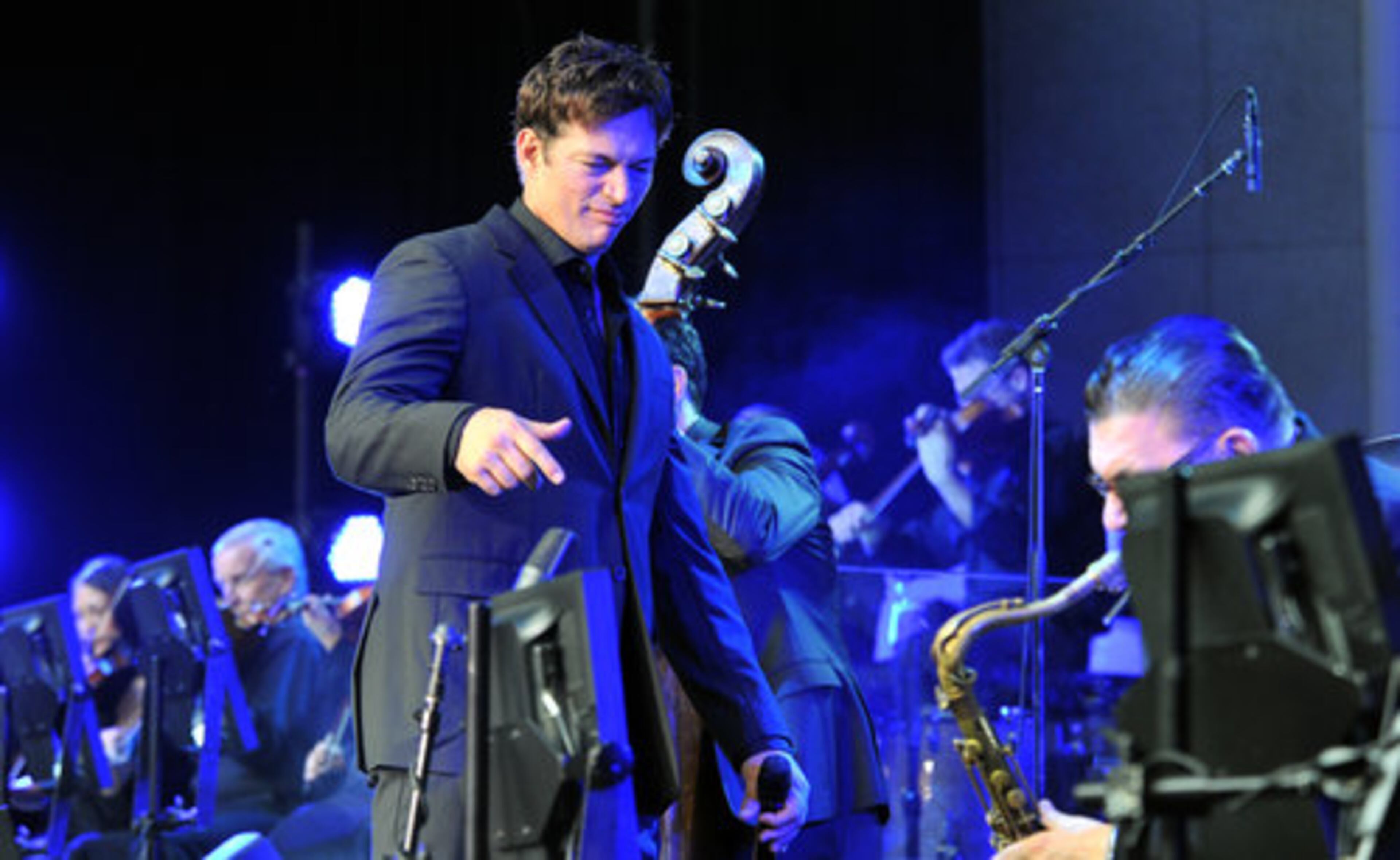 Harry Connick Jr. reacts to the rhythm of his orchestra during his concert at Chastain Park Amphitheatre Saturday night. The New Orleans native Connick was surrounded by jazz and art. Saturday, June 19, 2010.