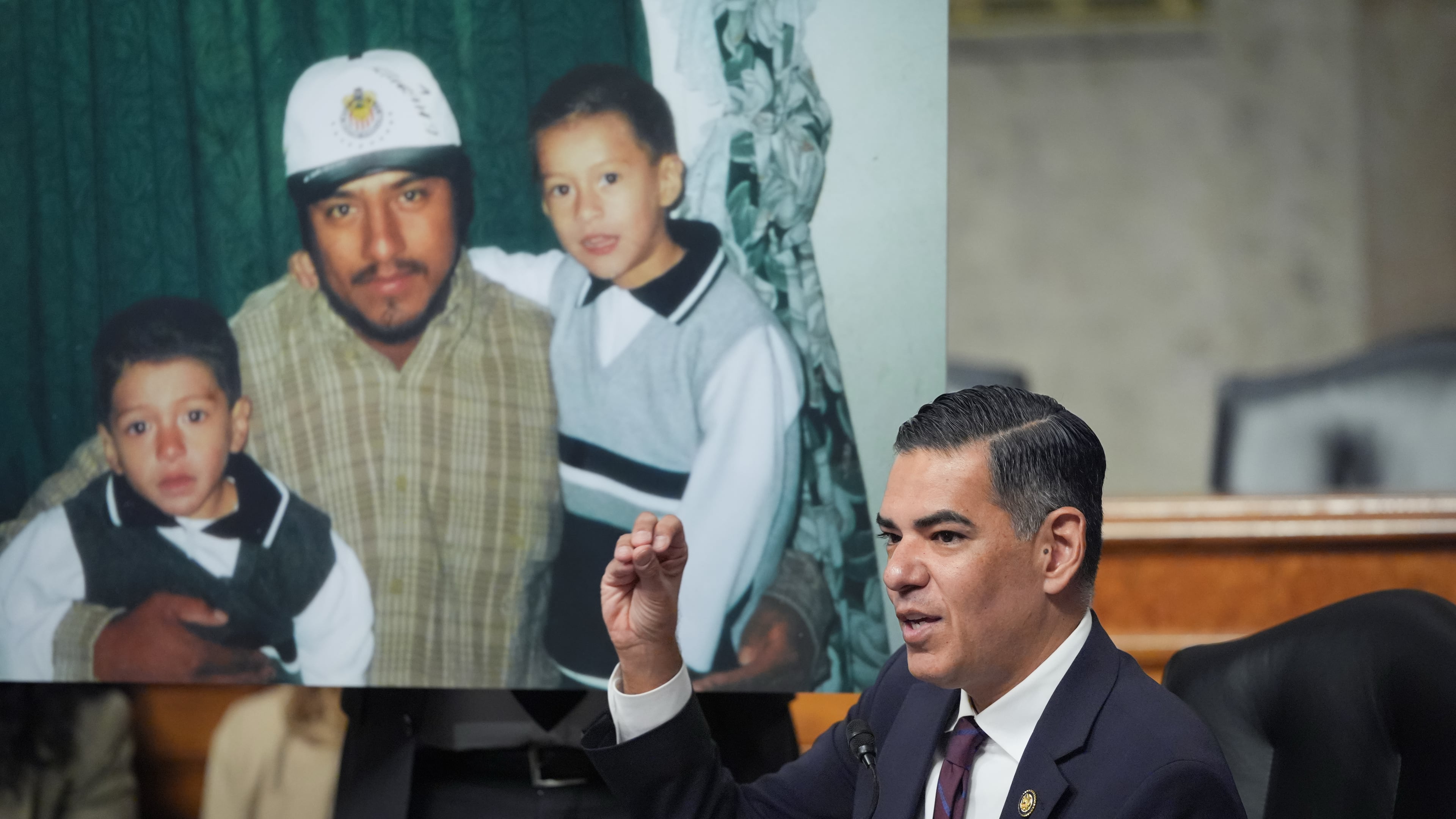 Rep. Robert Garcia (right), D-Calif., the ranking member of the House Oversight Committee, speaks Tuesday, Sept. 22, 2026, during a public forum on the fatal shootings of people by federal immigration agents carrying out President Donald Trump's mass deportation agenda. The photo displayed is of Lorenzo Salgado Araujo, who was shot and killed in Houston, Texas, by an ICE agent while Salgado Araujo was driving to work in 2025. (J. Scott Applewhite/AP)