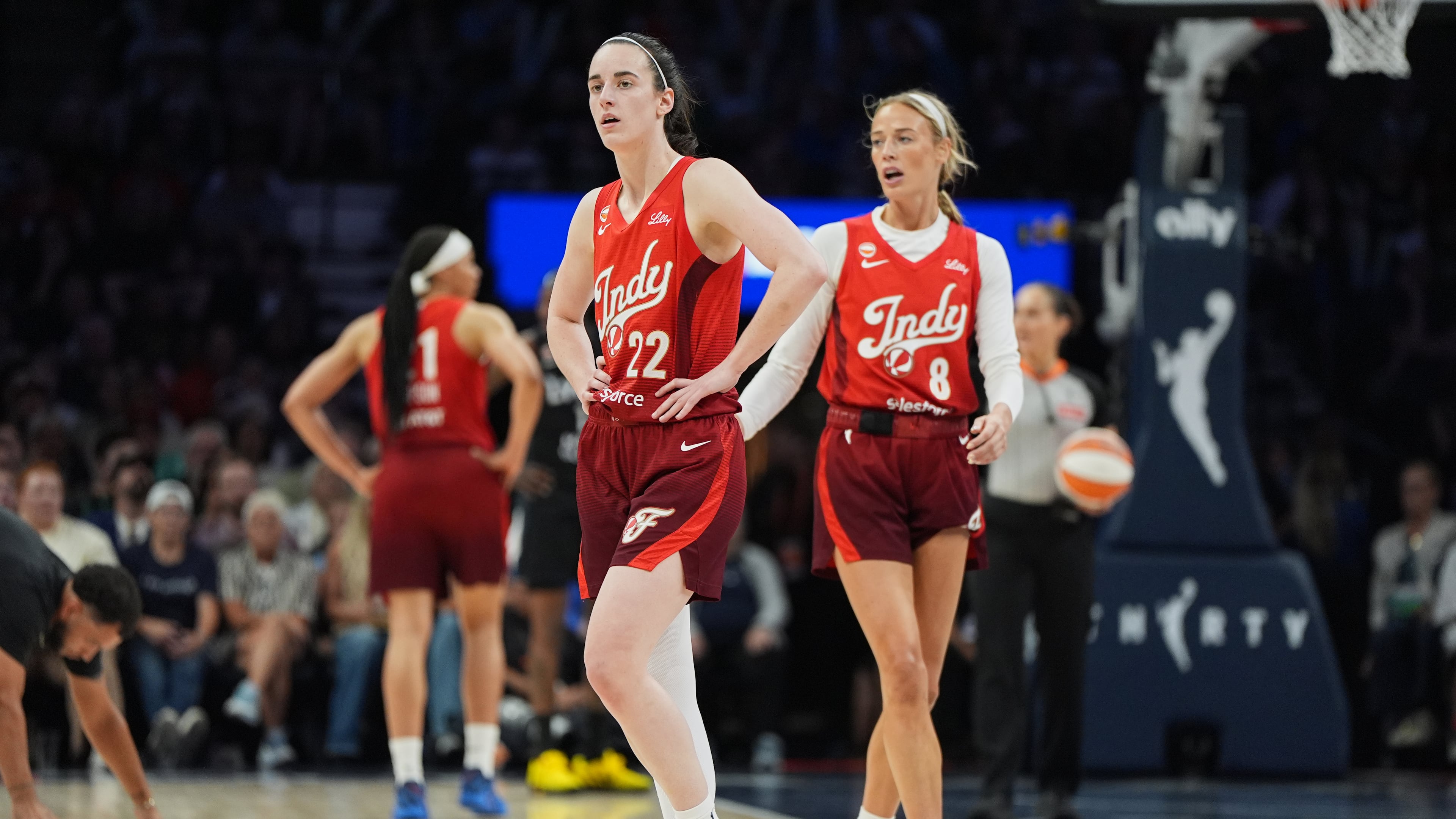 Indiana Fever guards Caitlin Clark (22) and Sophie Cunningham (8) wait for play to resume during the second half of a WNBA basketball game against the Minnesota Lynx, Sunday, Aug. 2, 2026, in Minneapolis. (AP Photo/Abbie Parr)