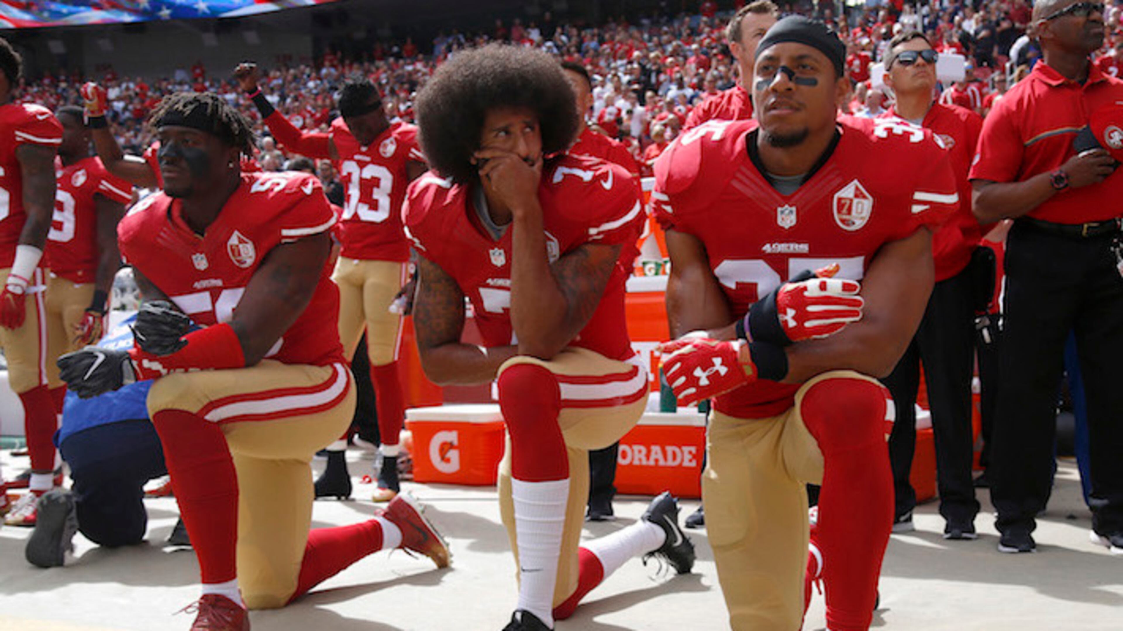 From left, The San Francisco 49ers' Eli Harold (58), Colin Kaepernick (7) and Eric Reid (35) kneel during the national anthem before their a game against the Dallas Cowboys on October 2, 2016, at Levi's Stadium in Santa Clara, Calif. (Nhat V. Meyer/Bay Area News Group/TNS)
