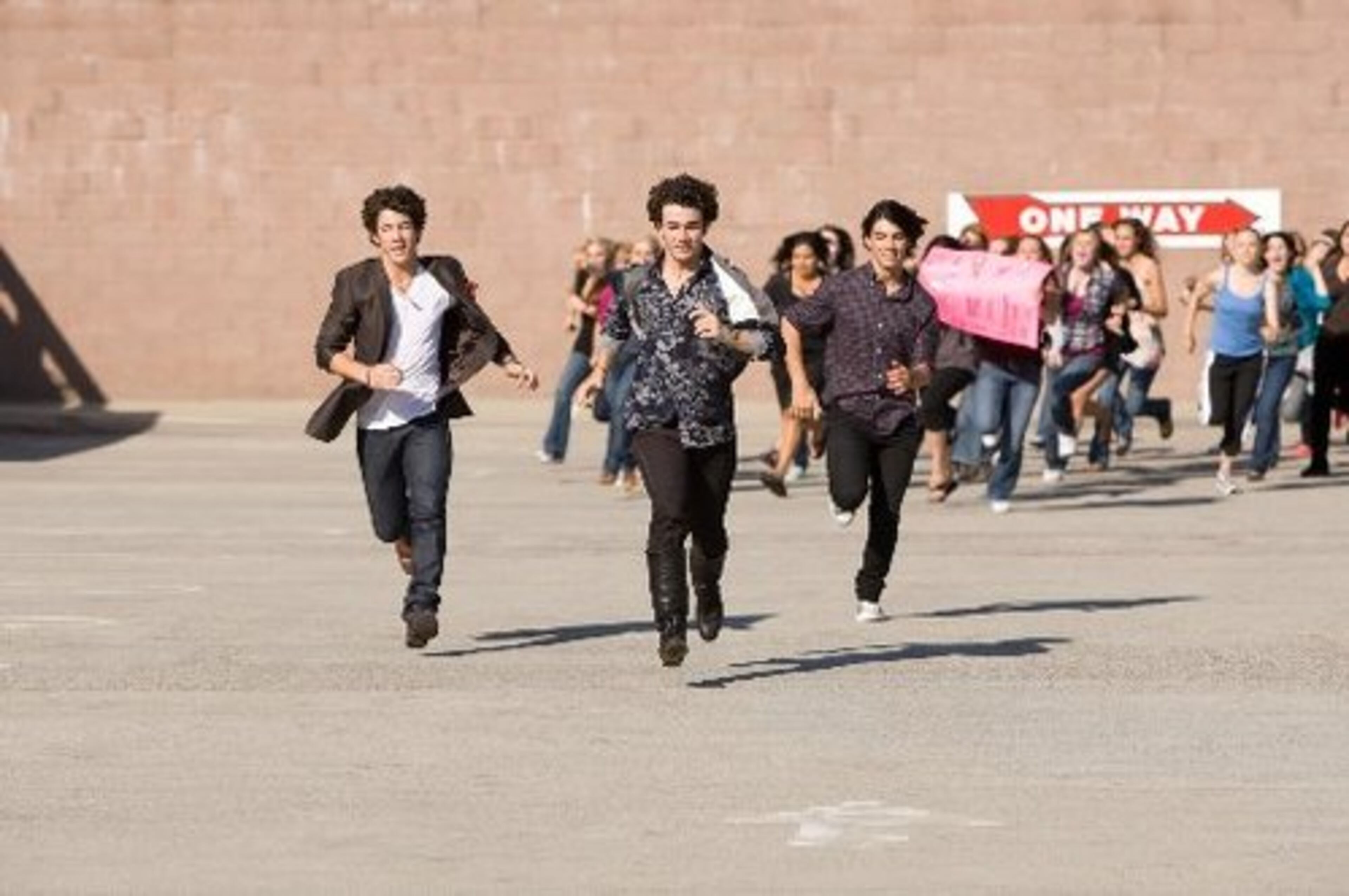 Is there a big sale at the mall? No, it's Nick, Kevin and Joe Jonas in a scene from their Disney movie, "Jonas Brothers: The 3D Concert Experience."
