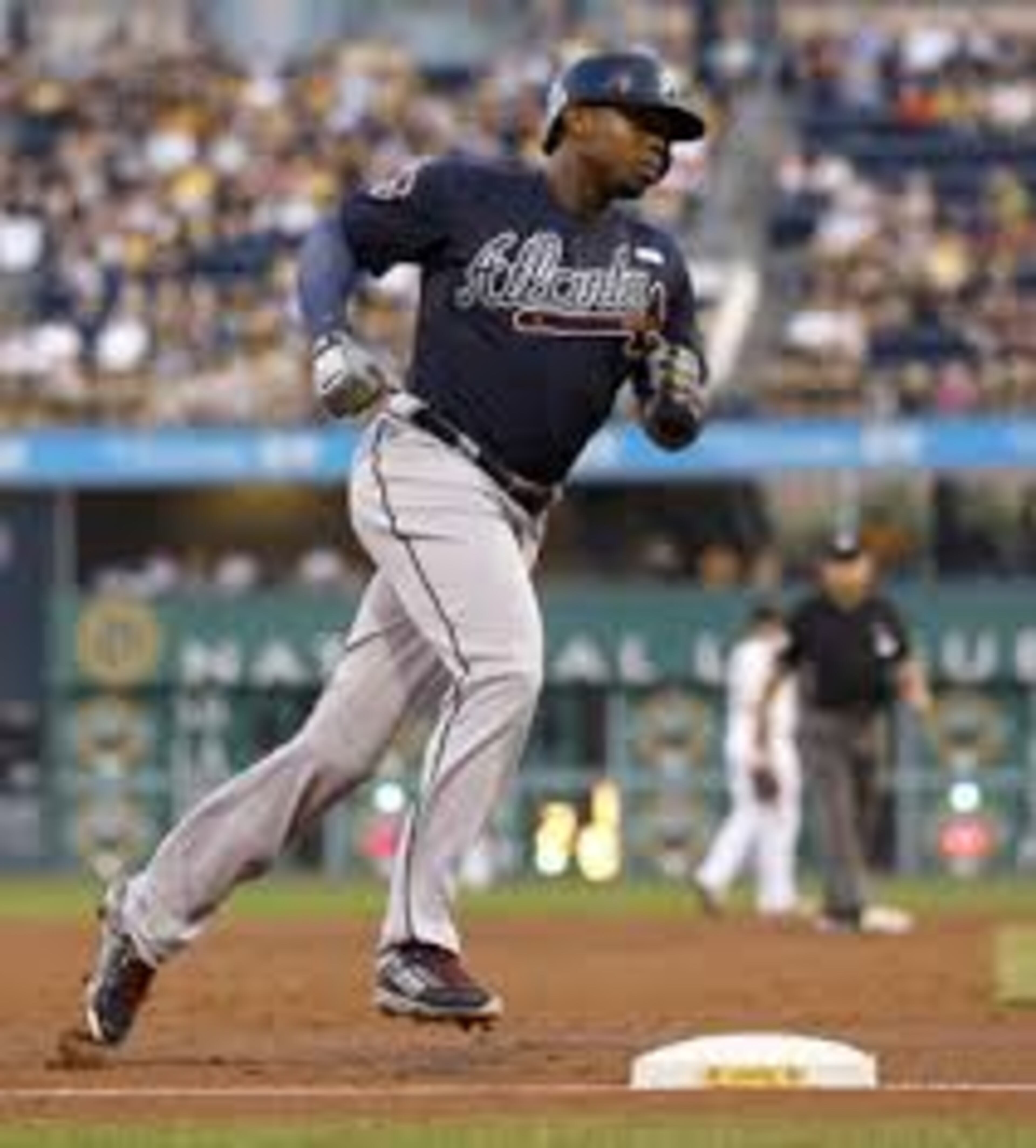 Justin Upton rounds the bases after his three-run homer Tuesday. He drove in five runs and hit the fourth homer of his 10-game hitting streak. (AP photo)