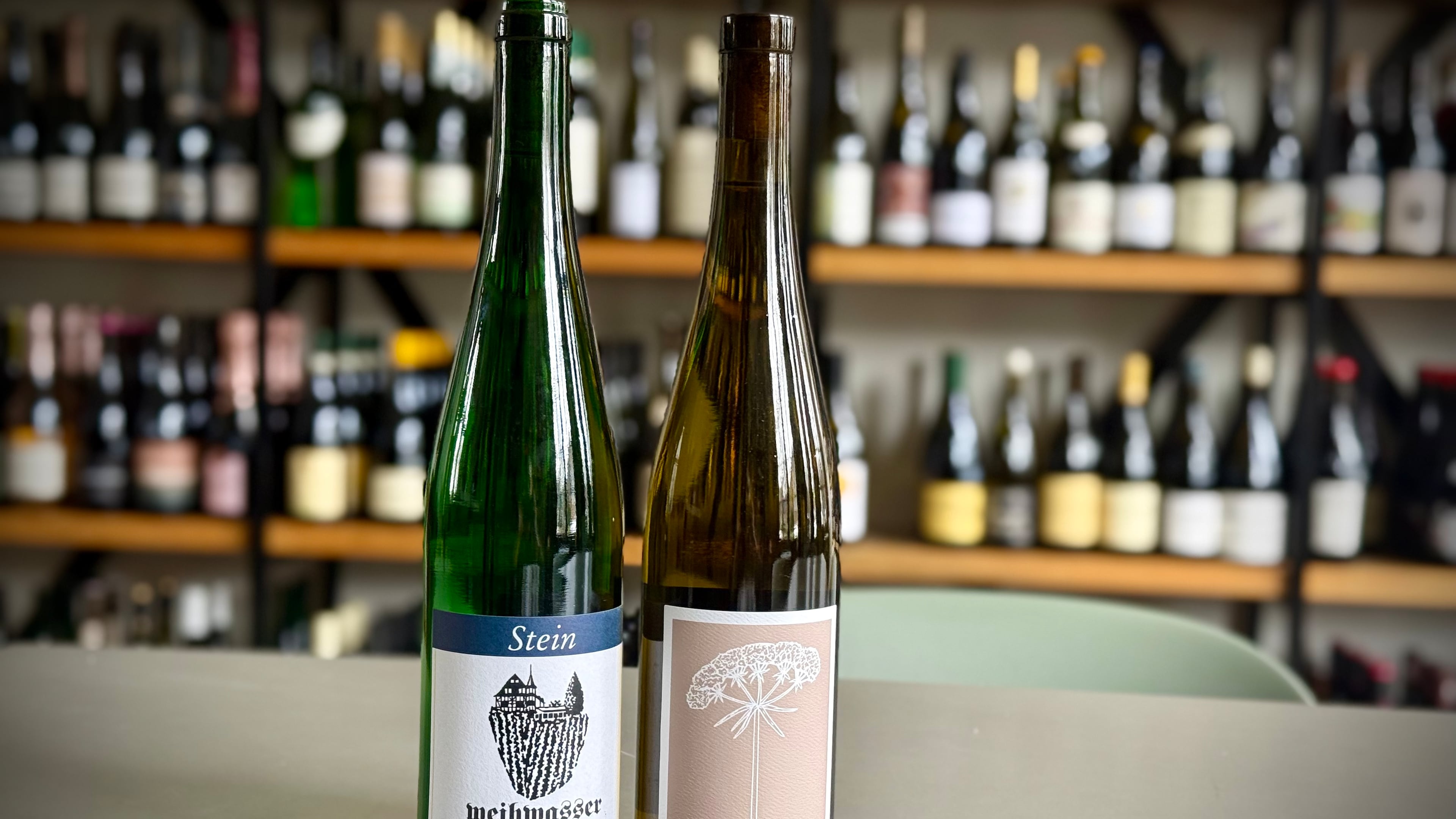 Two riesling wines in the loosely defined feinherb style, one from German producer Stein and another from New York winemaker Hermann J. Wiemer. (Krista Slater for the AJC)