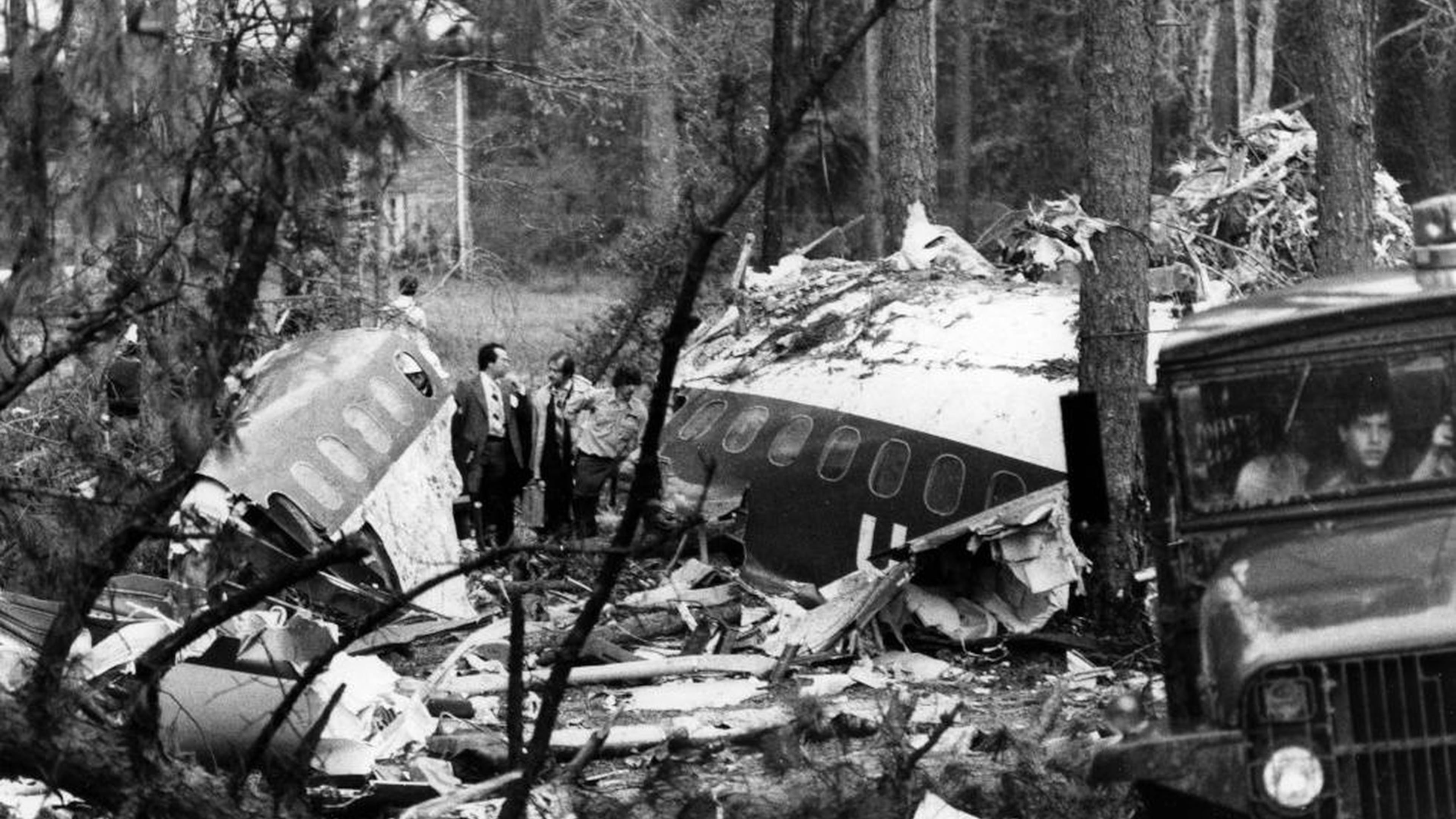Investigators stand amid the ruins of Southern Flight 242 on April 10, 1977.