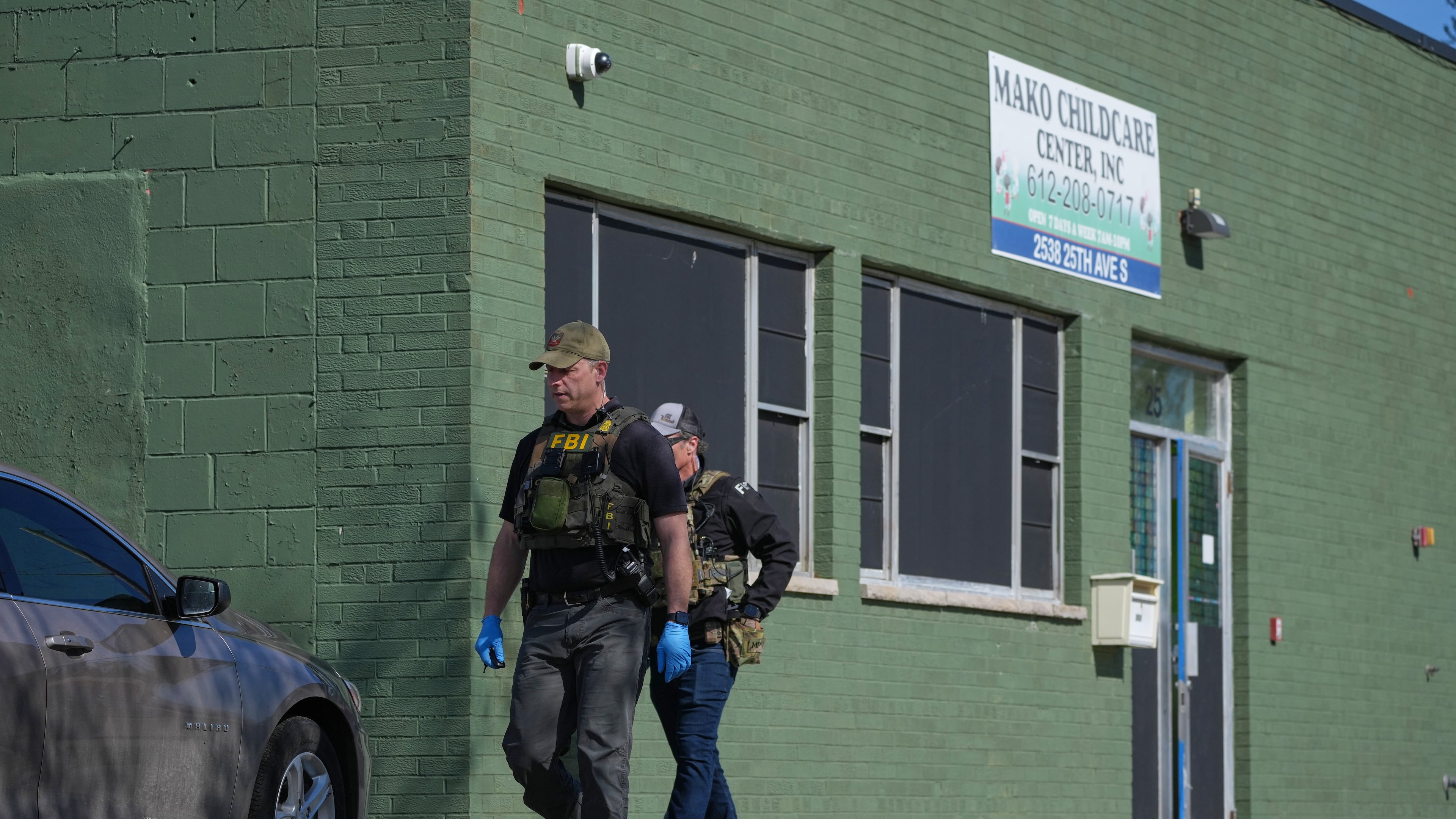 FBI agents walk outside the Mako Child Care Center in Minneapolis, Minn. on Tuesday, April 28, 2026. (Anthony Soufflé/Minnesota Star Tribune via AP)