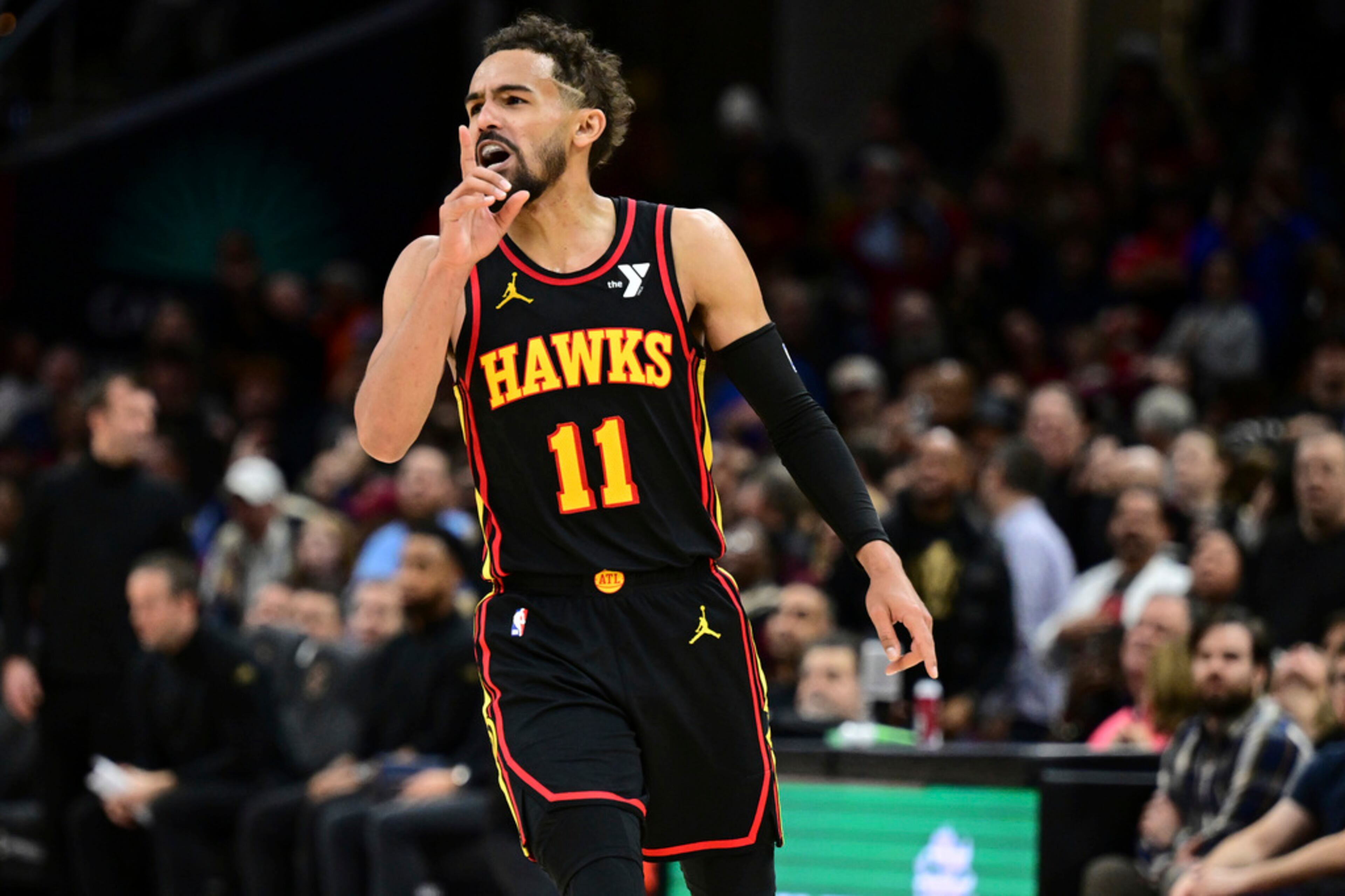 Atlanta Hawks guard Trae Young reacts after a three point basket in the second half of an NBA basketball game against the Cleveland Cavaliers, Wednesday, Nov. 27, 2024, in Cleveland. (AP Photo/David Dermer)