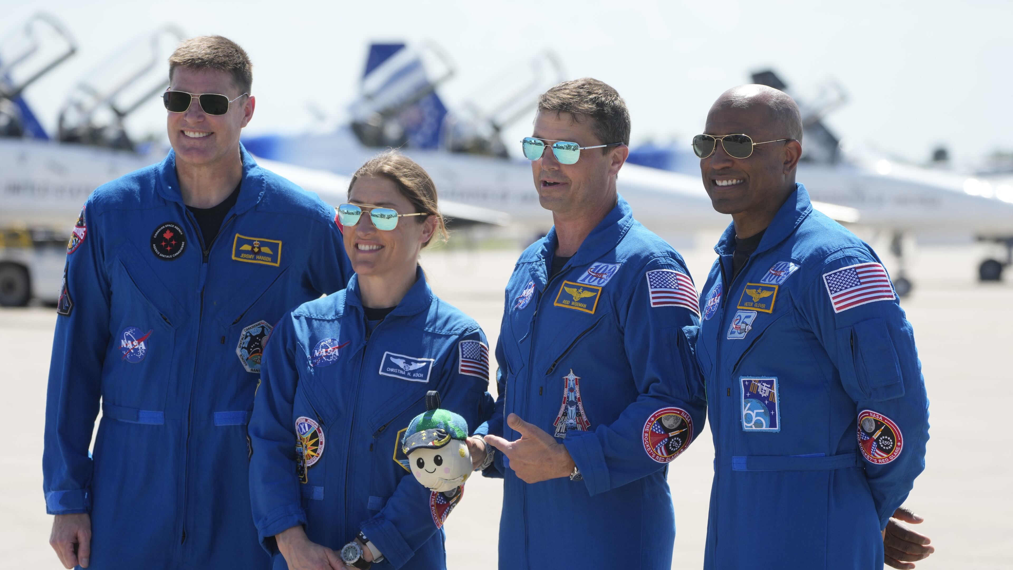 Artemis 2 crew members, from left, Mission Spc. Jeremy Hansen, of Canada, Mission Spc. Christina Koch, Commander Reid Wiseman, and Pilot Victor Glover pose for a photo after the crew's arrival at the Kennedy Space Center Friday, March 27, 2026, in Cape Canaveral, Fla. (AP Photo/Chris O'Meara)