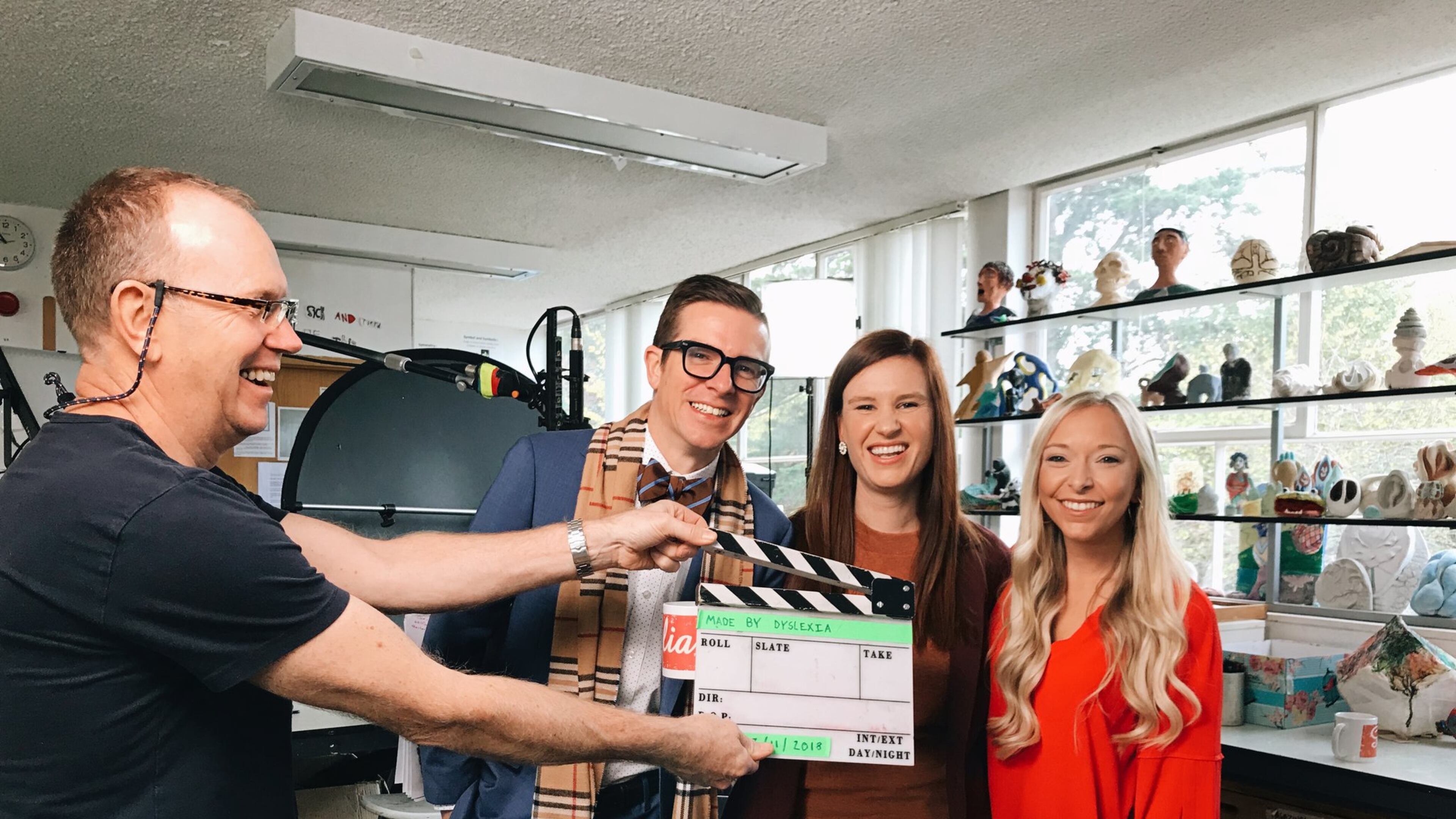 Staff from The Schenck School in Atlanta were highlighted in a series of videos that were made into an education program by Microsoft and Made by Dyslexia, a global nonprofit. A production assistant holds the slate clapper as Josh Clark, head of school, Hart Stuck, fifth grade teacher and Isoline Abels, second grade teacher prepare for a scene. COURTESY OF MICROSOFT