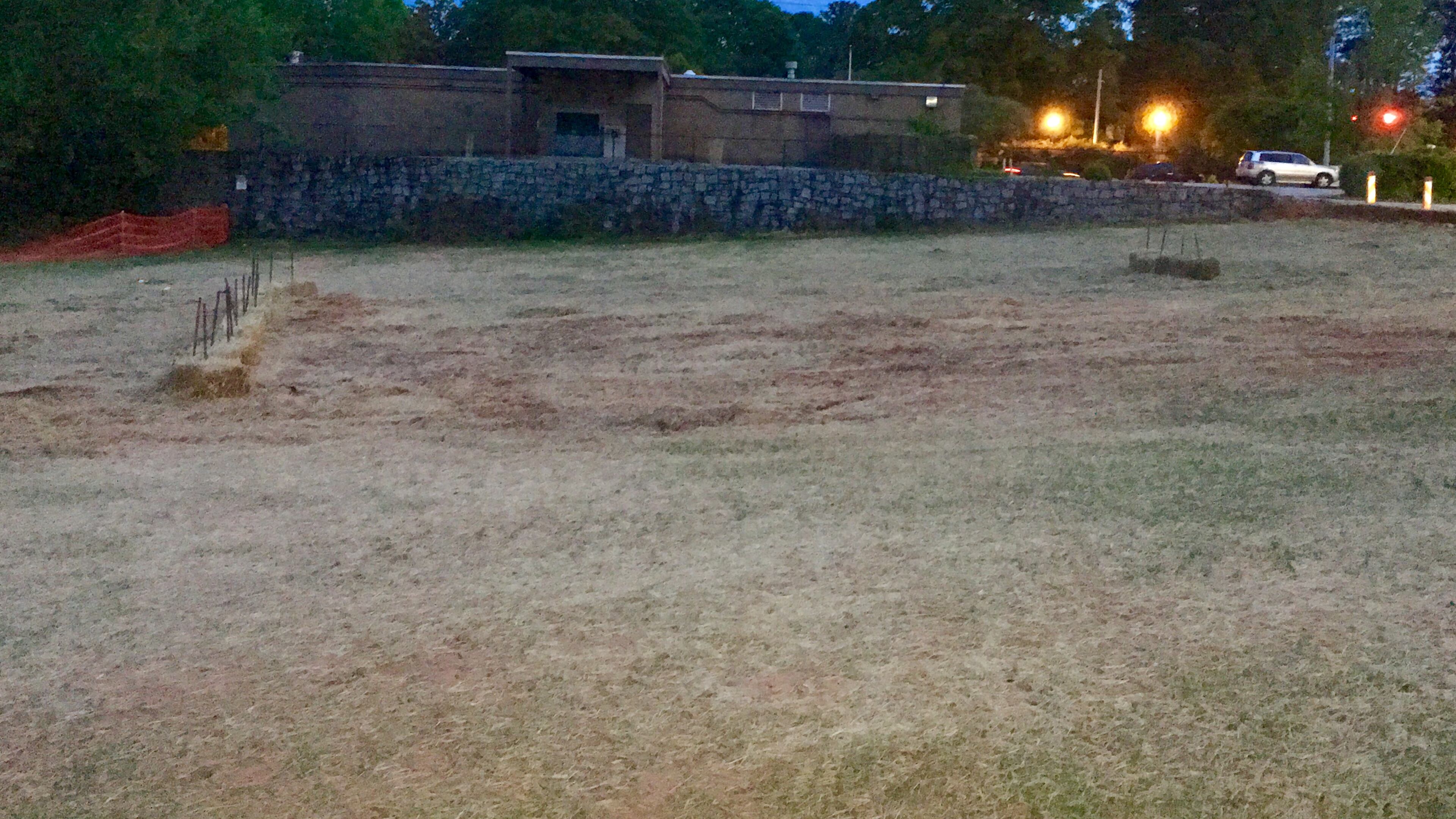 This is a portion of the site slated for a possible five-acre development in Avondale Estates’ downtown. The retaining wall in the background roughly marks the northern boundary for a future commercial development while the cleared area could become a two-acre park or town green. Bill Banks file photo for the AJC