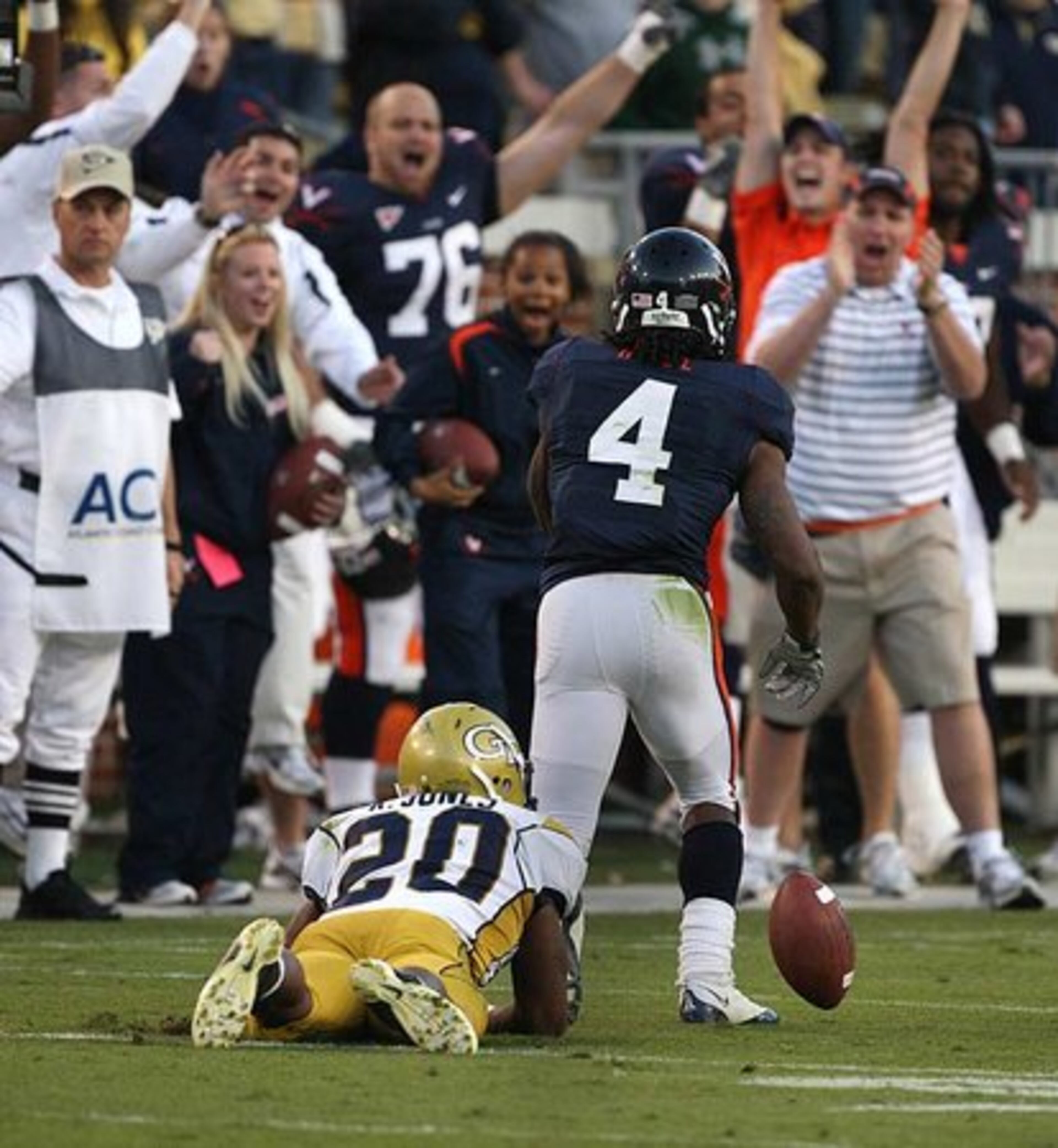 Georgia Tech's Roddy Jones remains on the turf after a pass thrown to him was intercepted by Virginia's Vic Hall in the game's final seconds.
