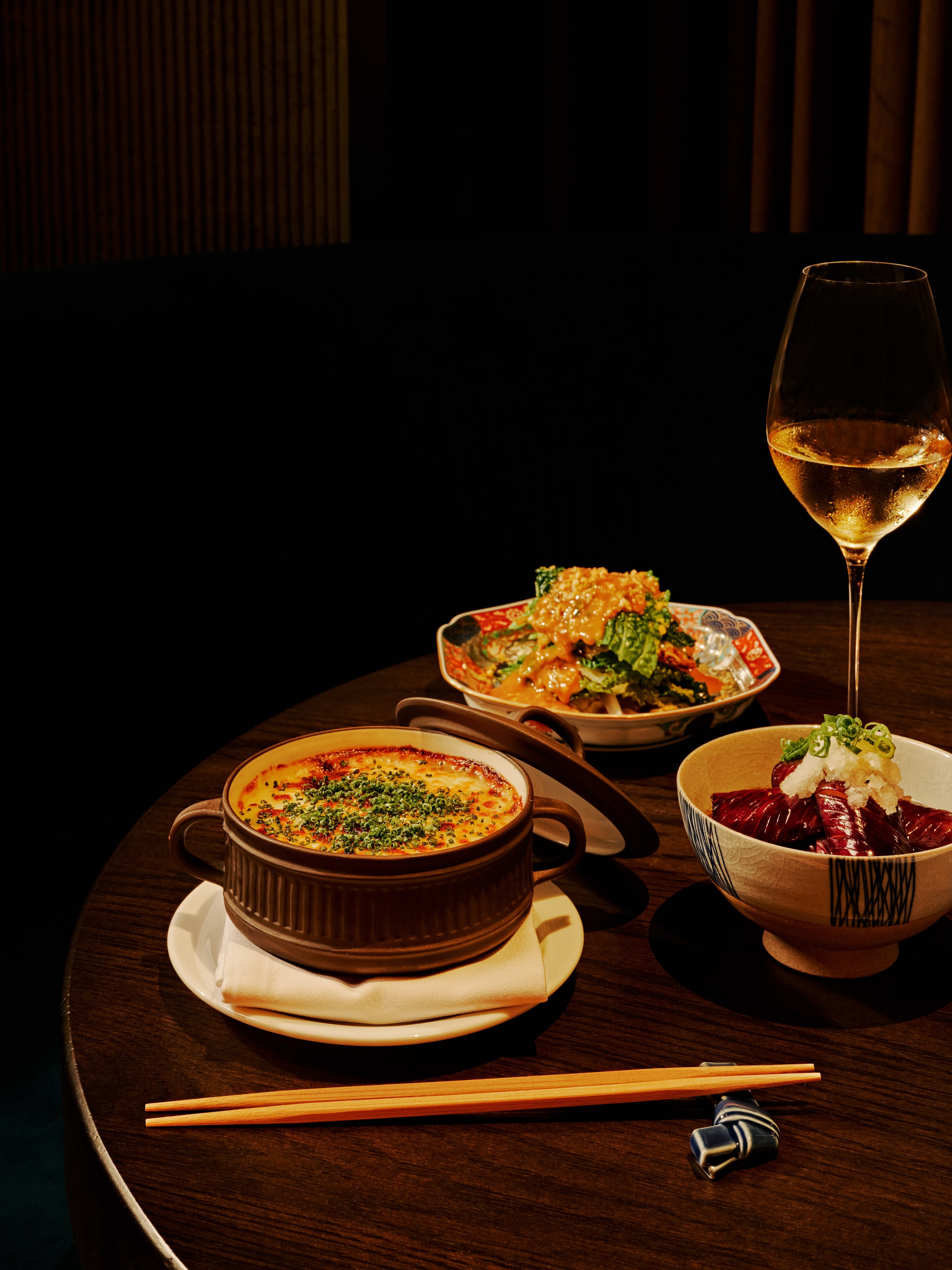 Side dishes at Koshu Club, including mushroom doria (left), yamitsuki cabbage (rear) and nasu agebitashi, a bowl of tender eggplant (right). (Andrew Thomas Lee/Courtesy of Koshu Club)