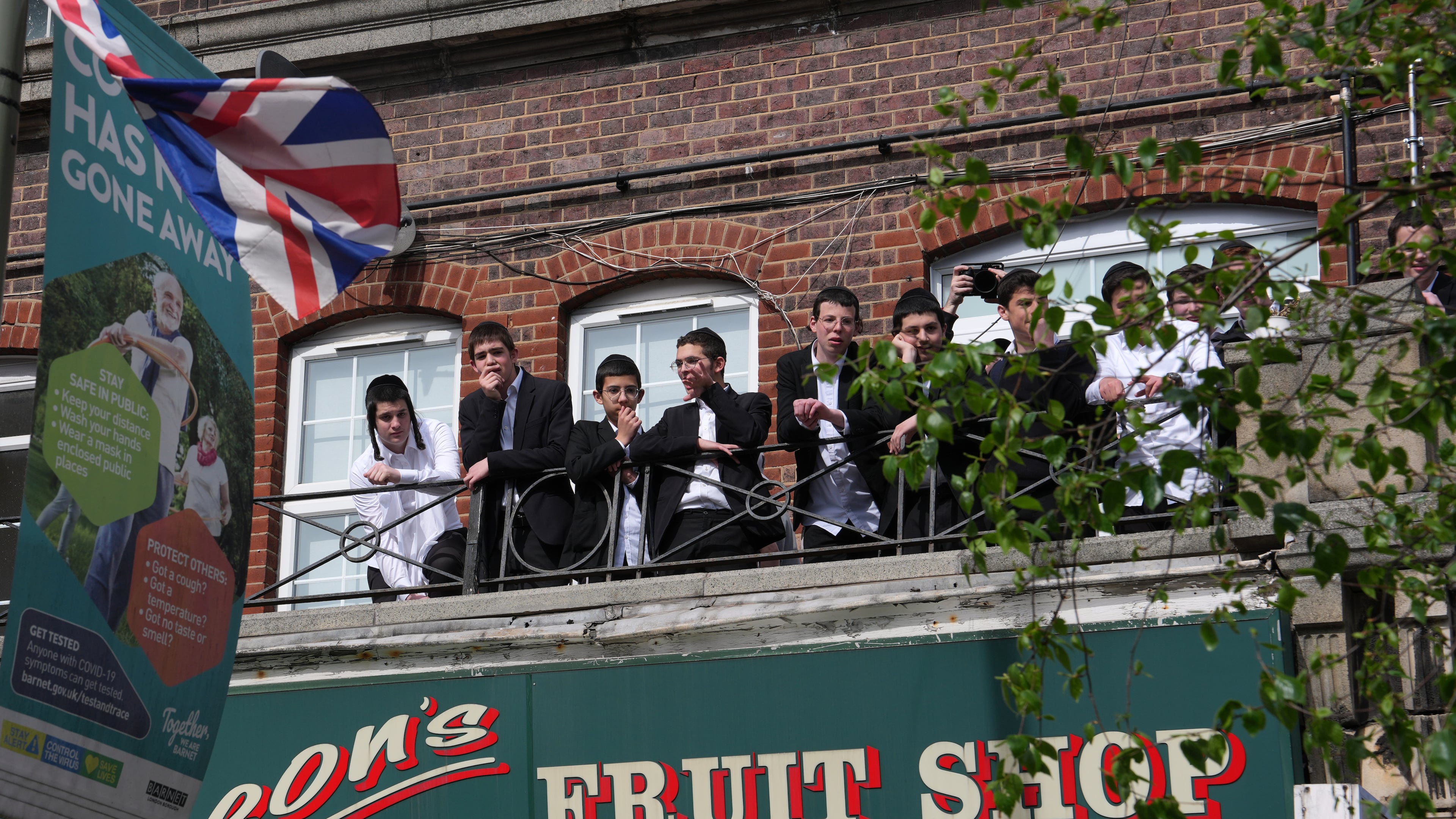 People look over the area where two people were stabbed in Golders Green neighbourhood, that has a large Jewish community, in London, Wednesday, April 29, 2026.(AP Photo/Kin Cheung)