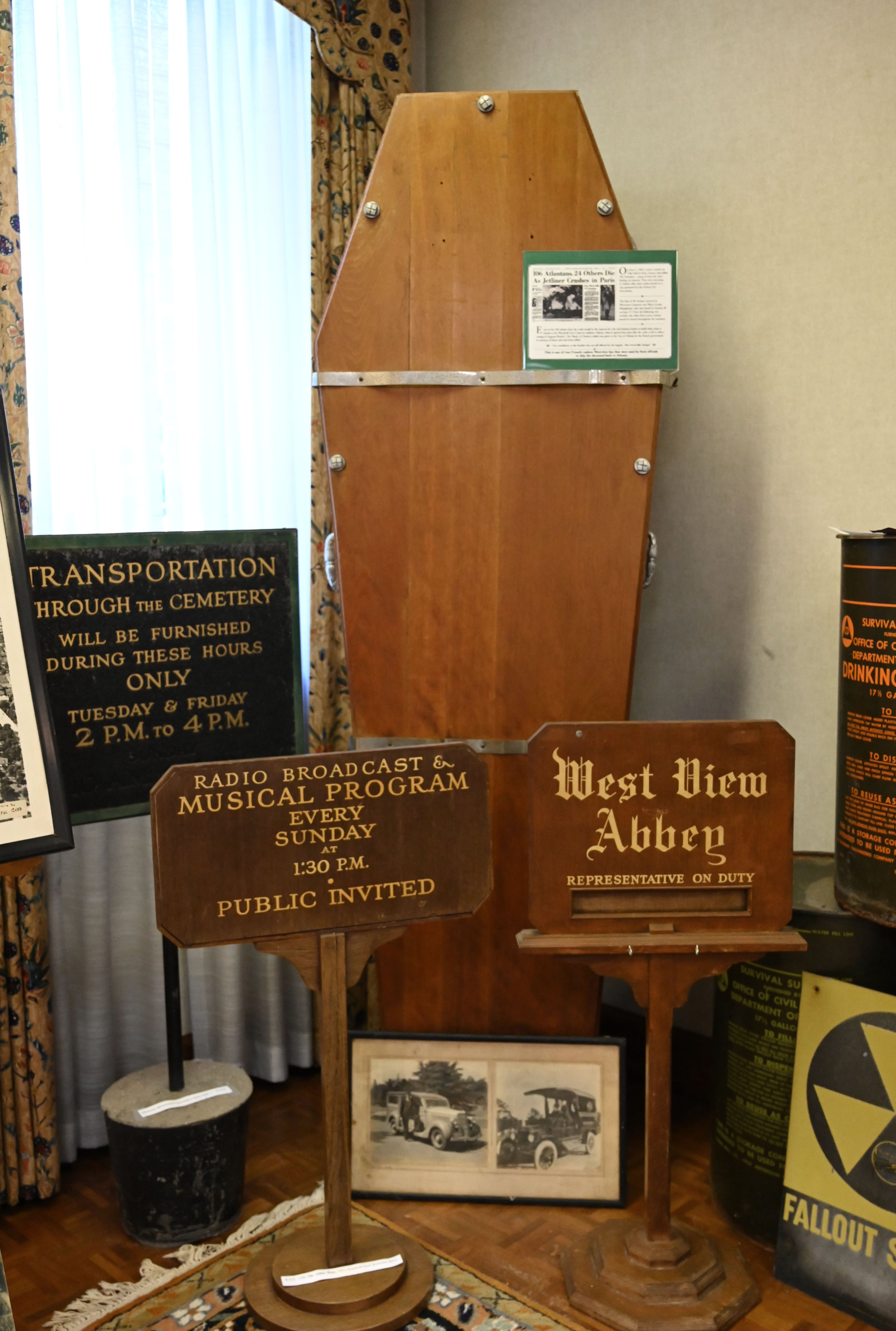 Administrator Jeff Clemmons wants to convert Westview’s 1890 stone gatehouse into a visitors center and small museum to display artifacts, such as this wooden coffin that was used to ship the remains of Atlantans home from France after the Orly plane crash of 1962. (Hyosub Shin/AJC)