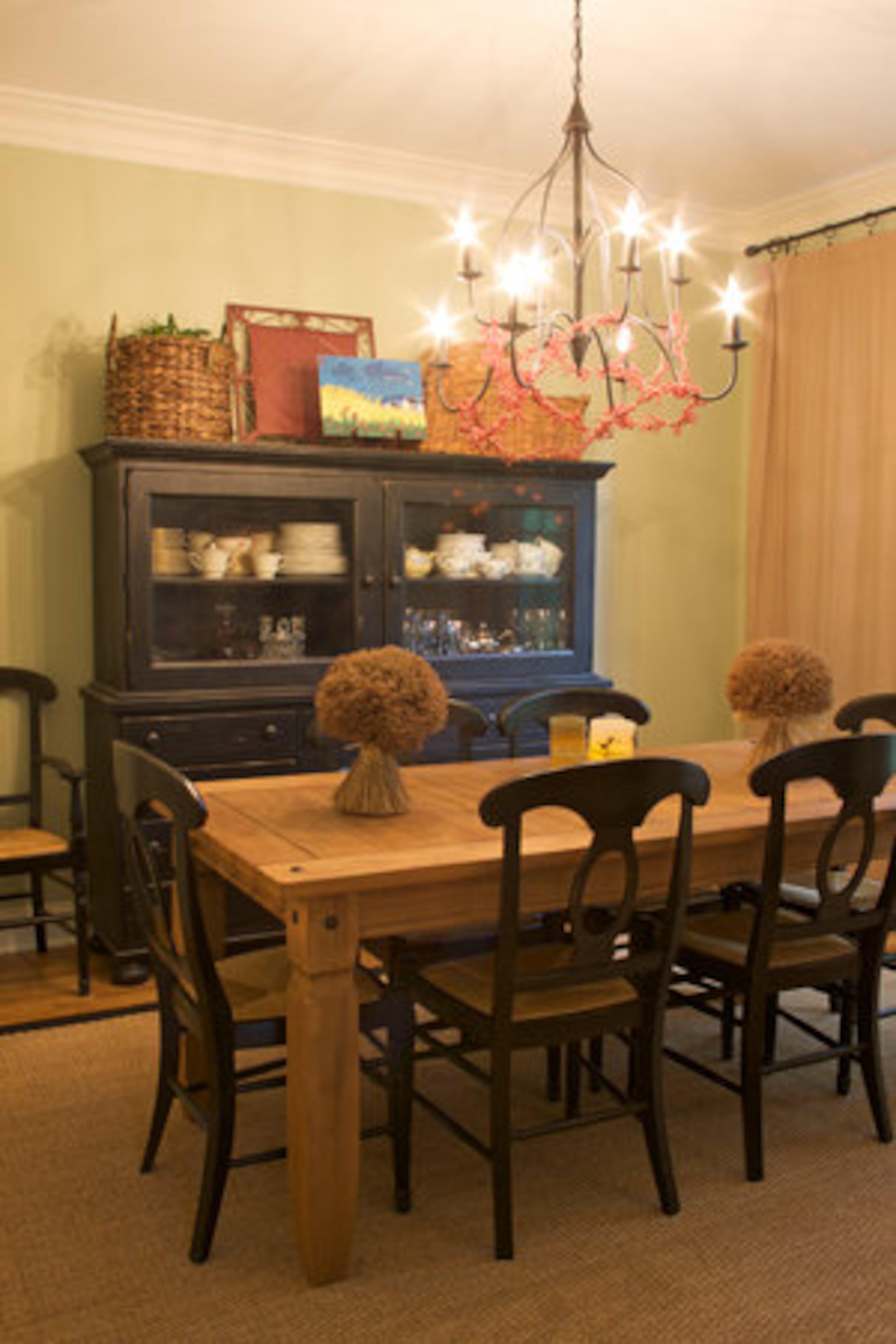 The Strickland family eats every meal together in the dining room. The new black hutch has been distressed to give it an old-fashioned feel.