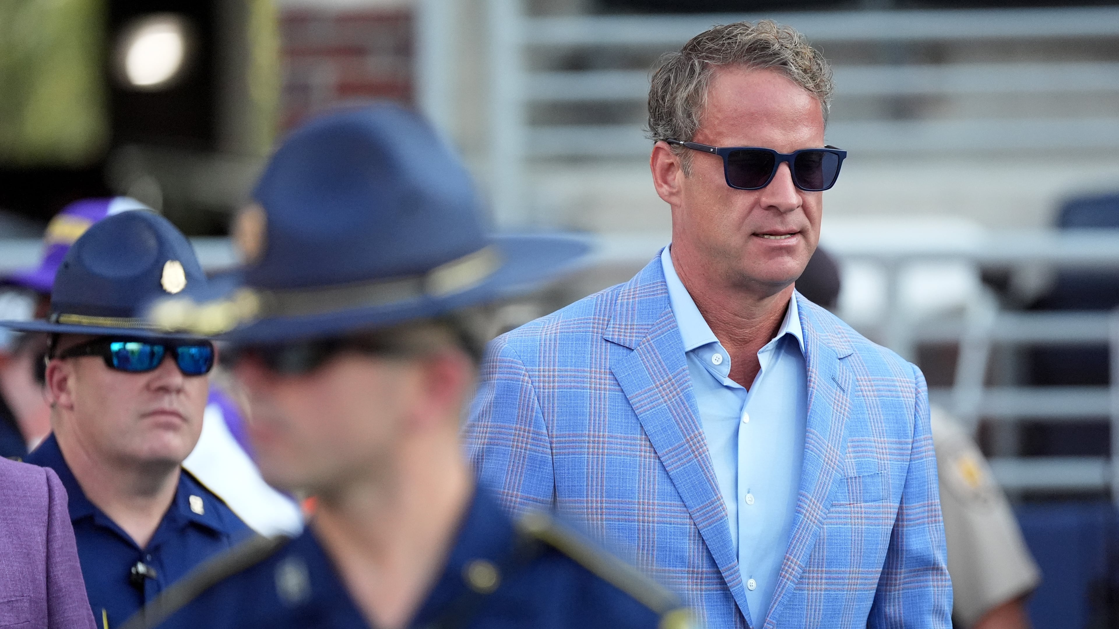 LSU coach Lane Kiffin follows his protection detail of Louisiana State Police on Saturday, Sept. 19, 2026, before the Tigers' game against Ole Miss in Oxford, Miss. (Rogelio V. Solis/AP)