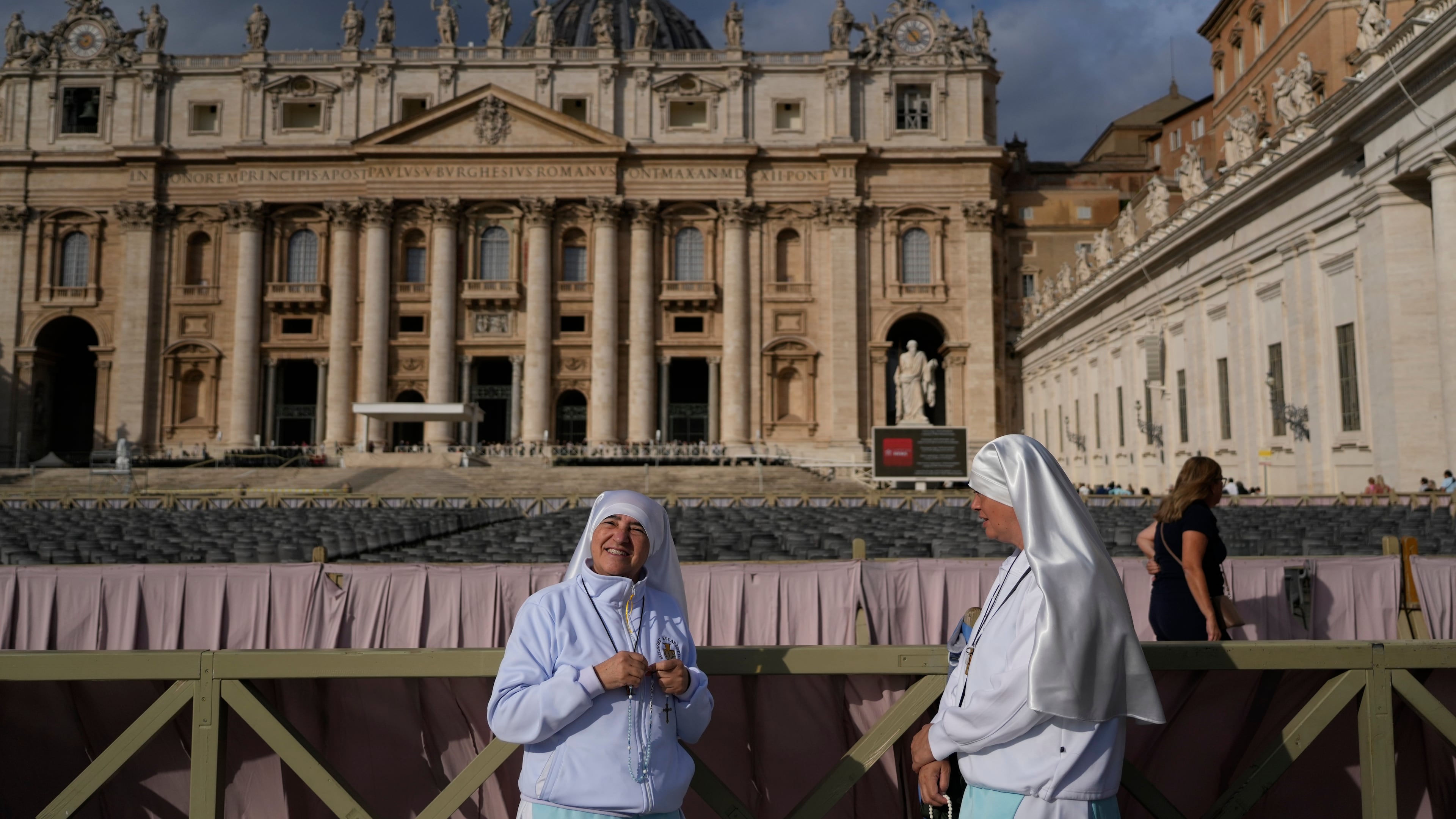Two nuns arrive in St. Peter's Square at the Vatican for the traditional noon blessing after praying the Angelus with Pope Leo XIV, Sunday, Oct. 18, 2026, a day after he returned from the hospital, where he had lung cancer removed on Tuesday. (AP Photo/Gregorio Borgia)