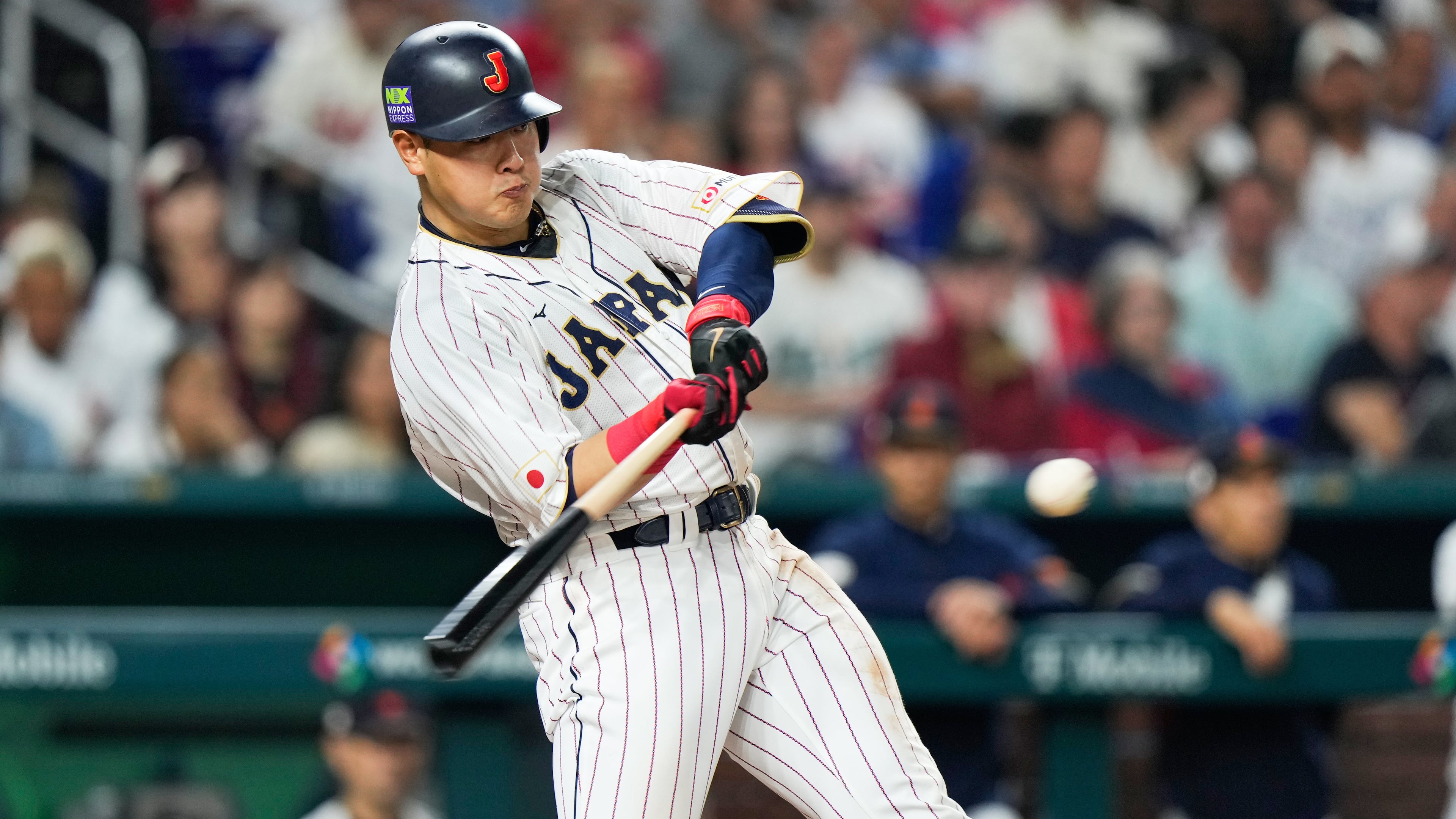 FILE - Japan's Kazuma Okamoto hits a home run during fourth inning of a World Baseball Classic championship game against the United States, March 21, 2023, in Miami. (AP Photo/Wilfredo Lee, File)
