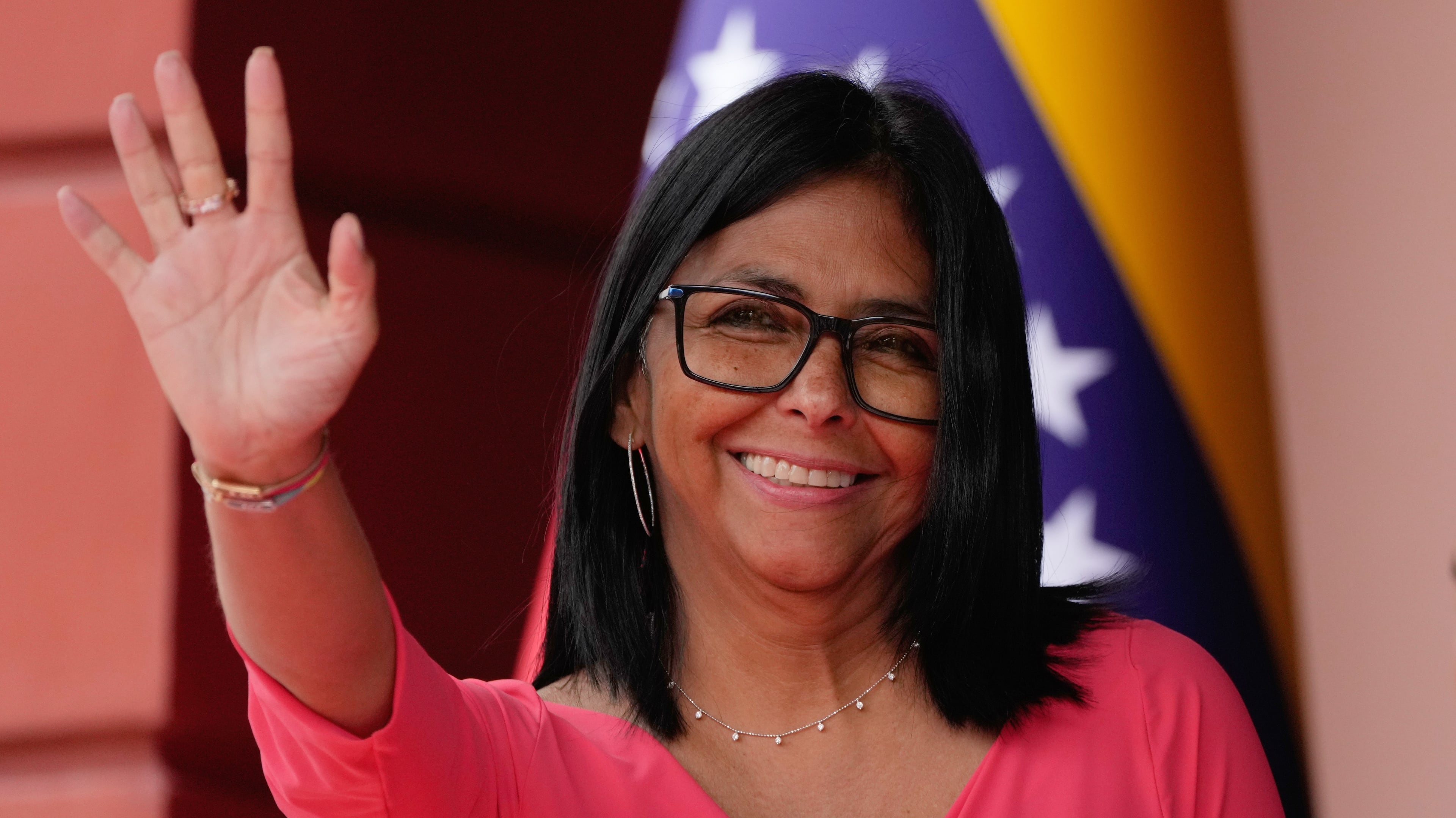 FILE - Venezuela's acting President Delcy Rodriguez waves as she waits for Colombian President Gustavo Petro at Miraflores Palace in Caracas, Venezuela, Friday, April 24, 2026. (AP Photo/Ariana Cubillos, File)