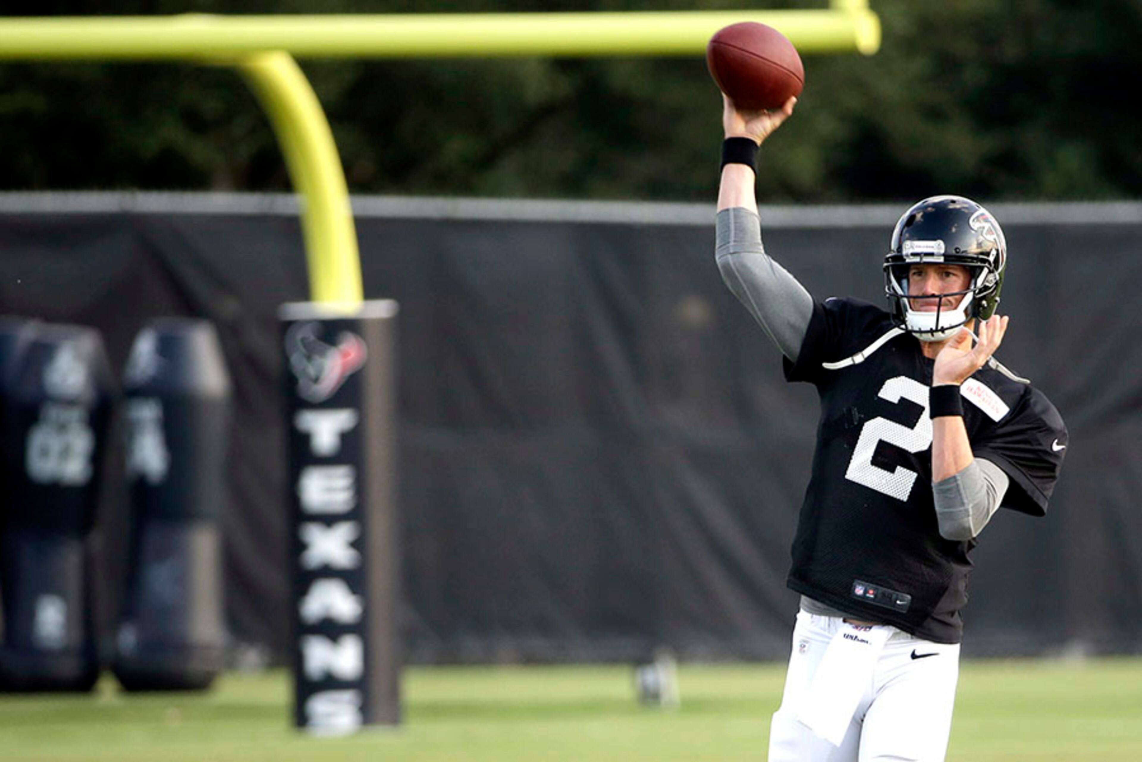 Falcons quarterback Matt Ryan throws a pass during an NFL football training camp practice Wednesday, Aug. 13, 2014, in Houston. The Falcons are practicing with the Houston Texans this week before their preseason game Saturday