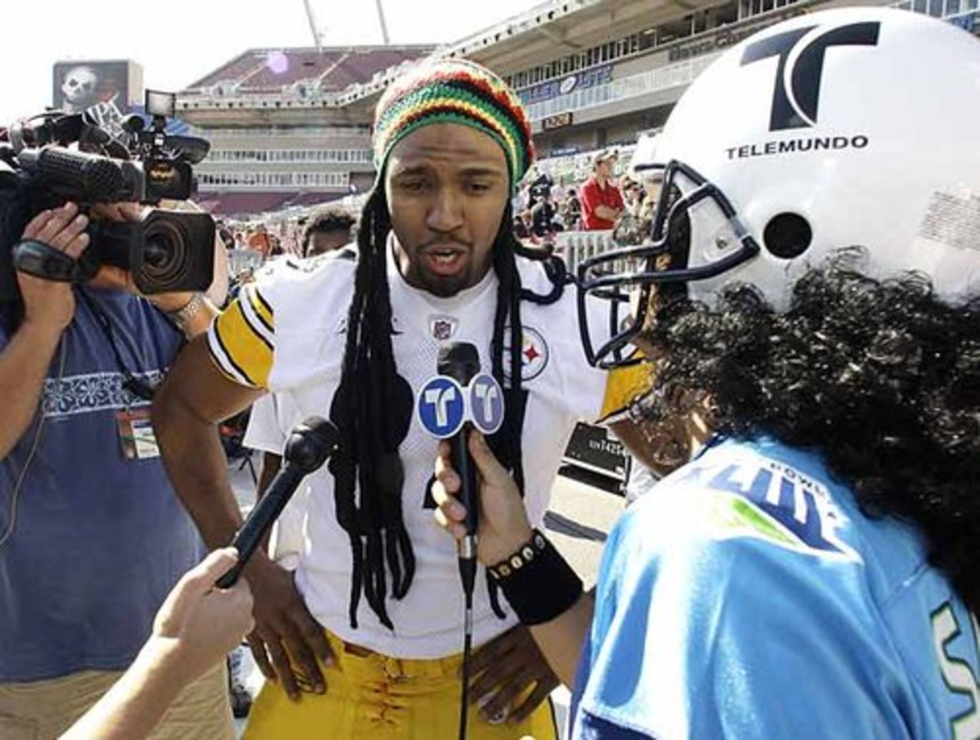 Pittsburgh's Dezmond Sherrod sports some color during his interview with Karim Mendiburu (right) of Telemundo.