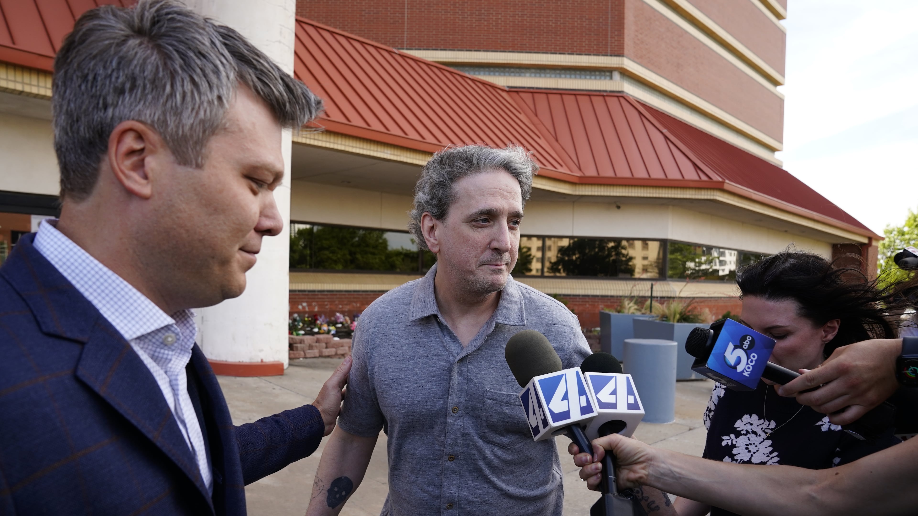 Former death row prisoner Richard Glossip, center, speaks to media after exiting a detention facility after being granted bond while awaiting retrial Thursday, May 14, 2026, in Oklahoma City. (AP Photo/Nick Oxford)