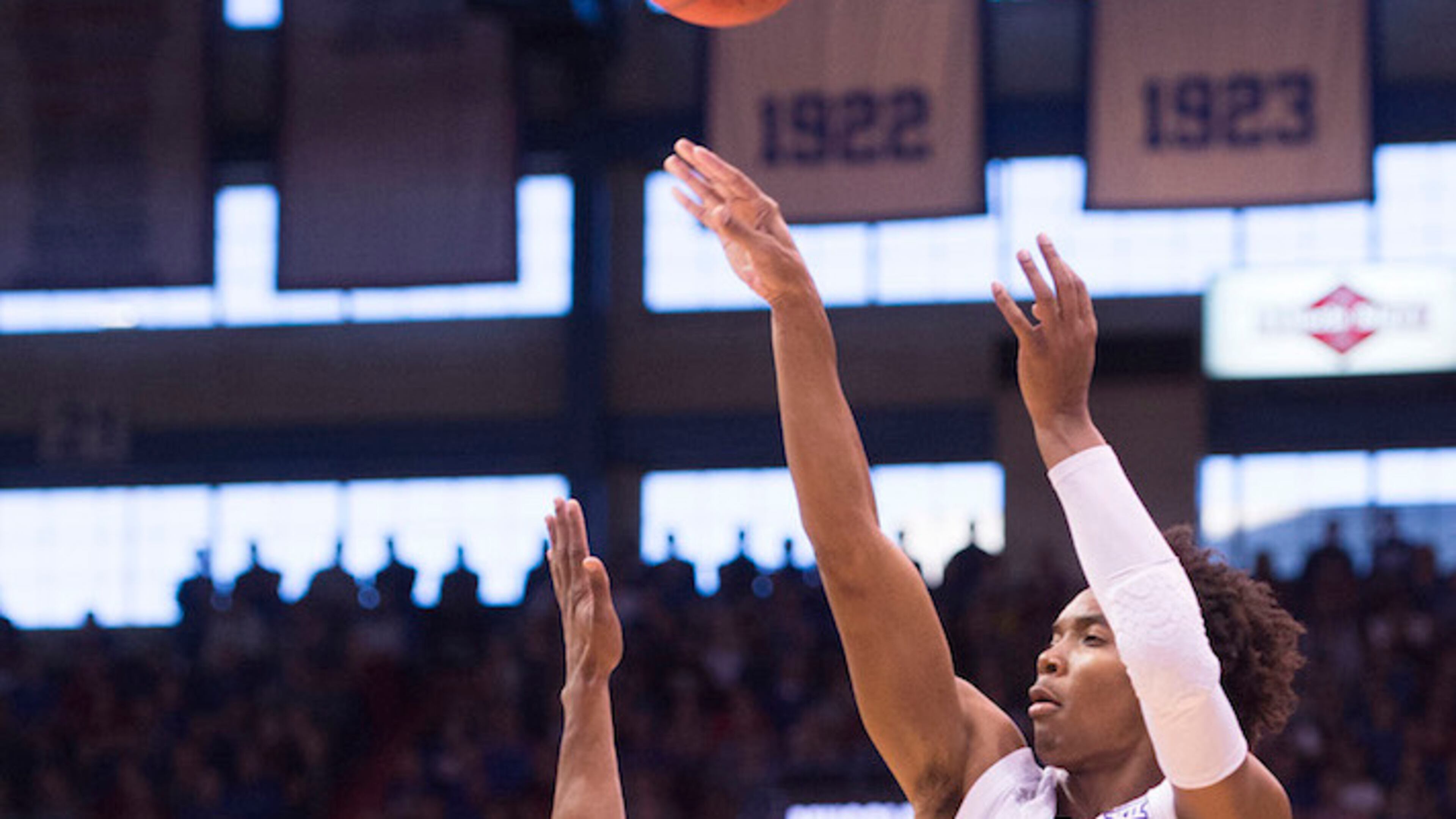 Arizona State Sun Devils guard Shannon Evans II (11) defends a three-pointer by Kansas Jayhawks guard Devonte Graham (4) in the first half on Sunday, Dec. 10, 2017 at the University of Kansas in Allen Fieldhouse in Lawrence, Kan. (Shane Keyser/Kansas City Star/TNS)