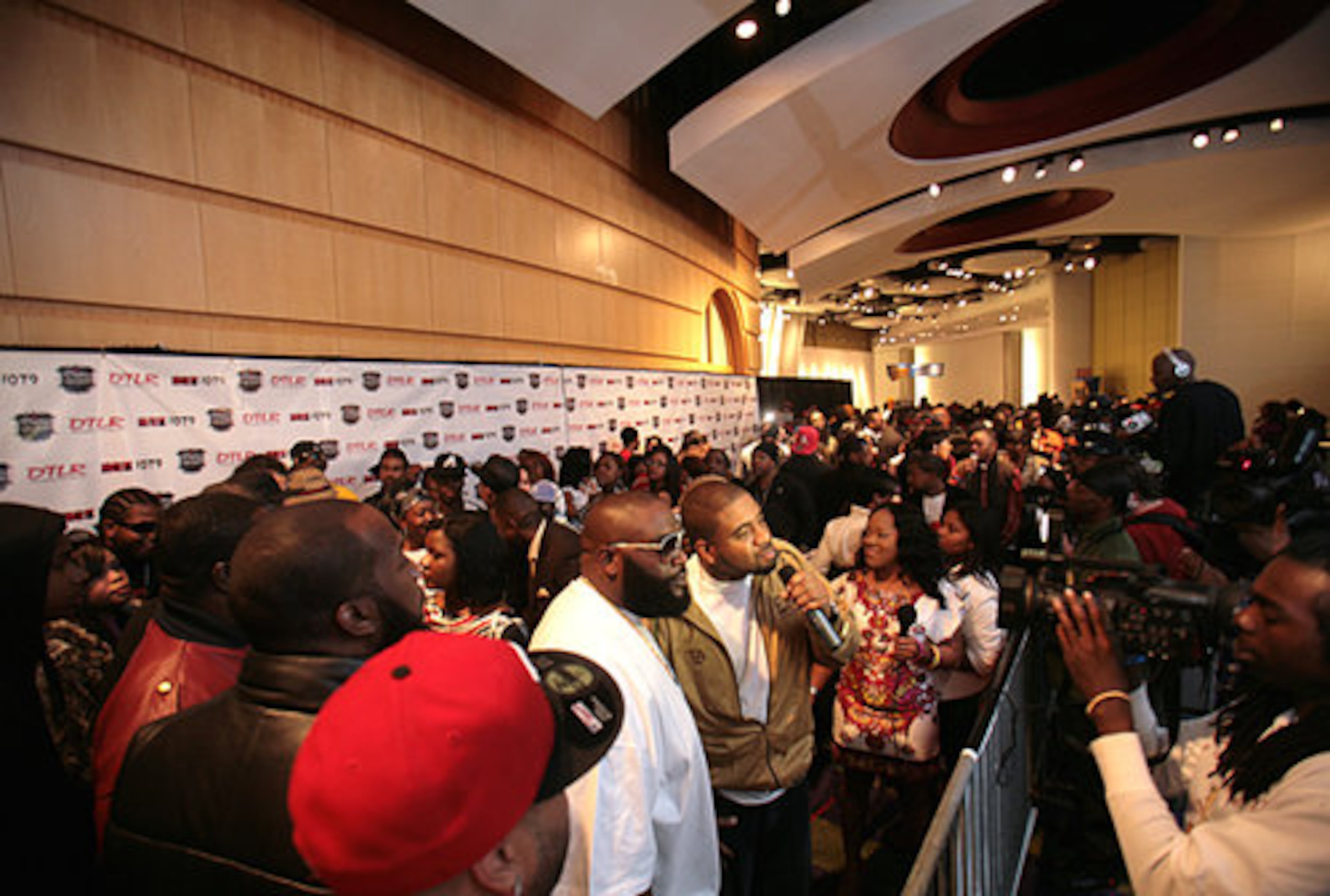 Artists are interviewed on the black carpet before the awards show.