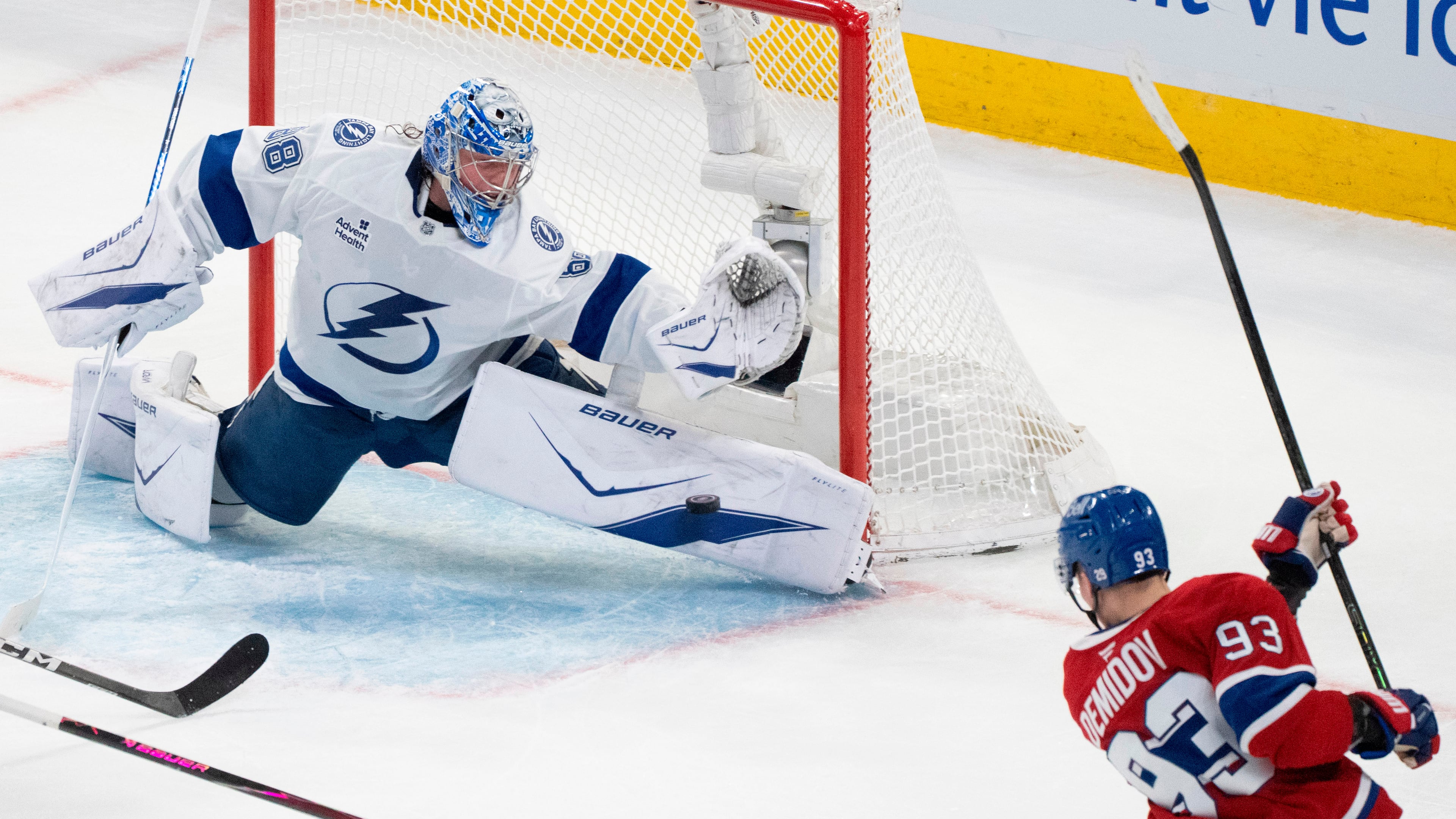 Tampa Bay Lightning goaltender Andrei Vasilevskiy (88) stops a shot by Montreal Canadiens' Ivan Demidov (93) during the second period of Game 6 in the first round of an NHL hockey Stanley Cup playoff series in Montreal, Friday, May 1, 2026. (Christinne Muschi/The Canadian Press via AP)