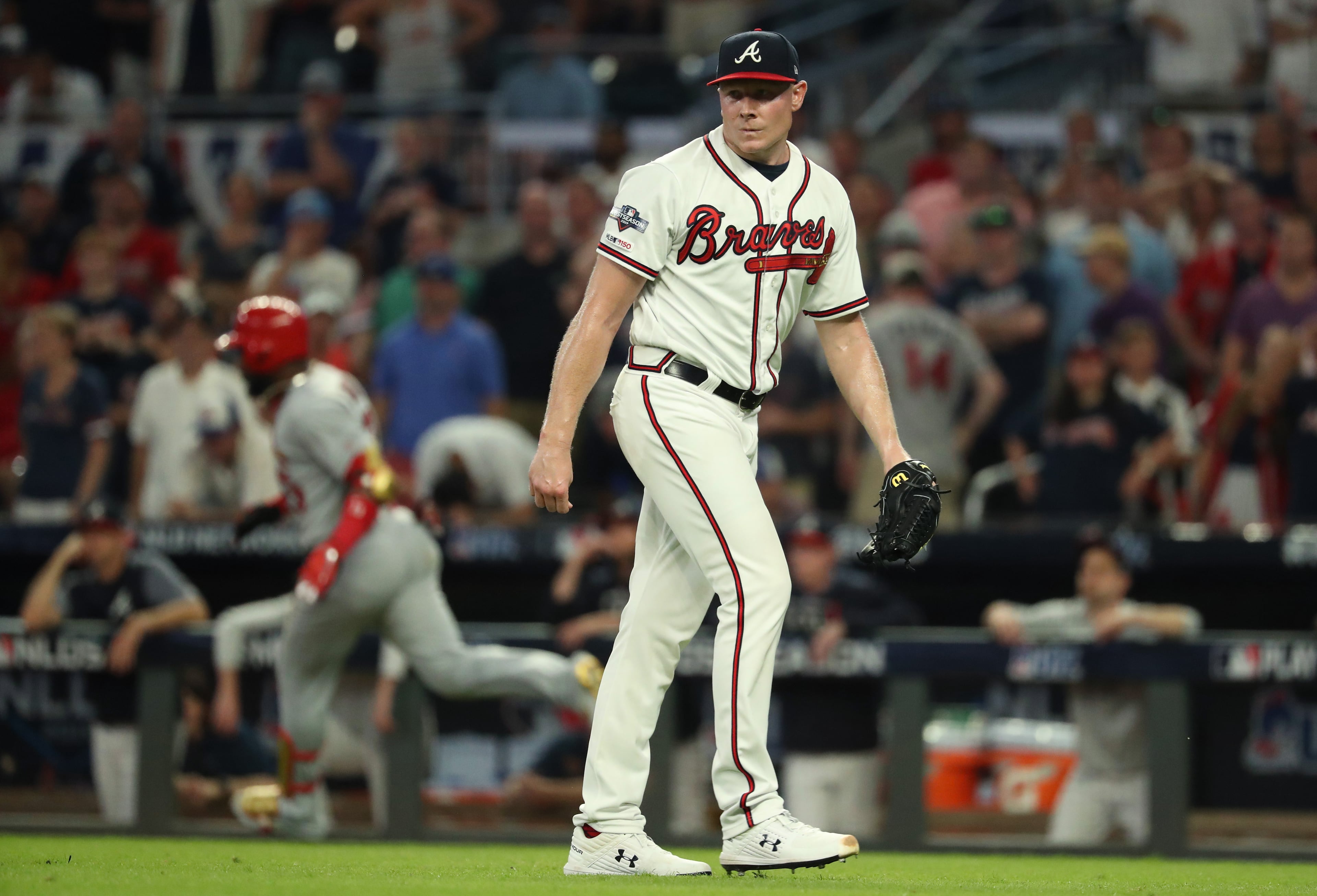 Braves relief pitcher Mark Melancon reacts after giving up a two-run double to St. Louis Cardinals left fielder Marcell Ozuna. (JASON GETZ/SPECIAL TO THE AJC)