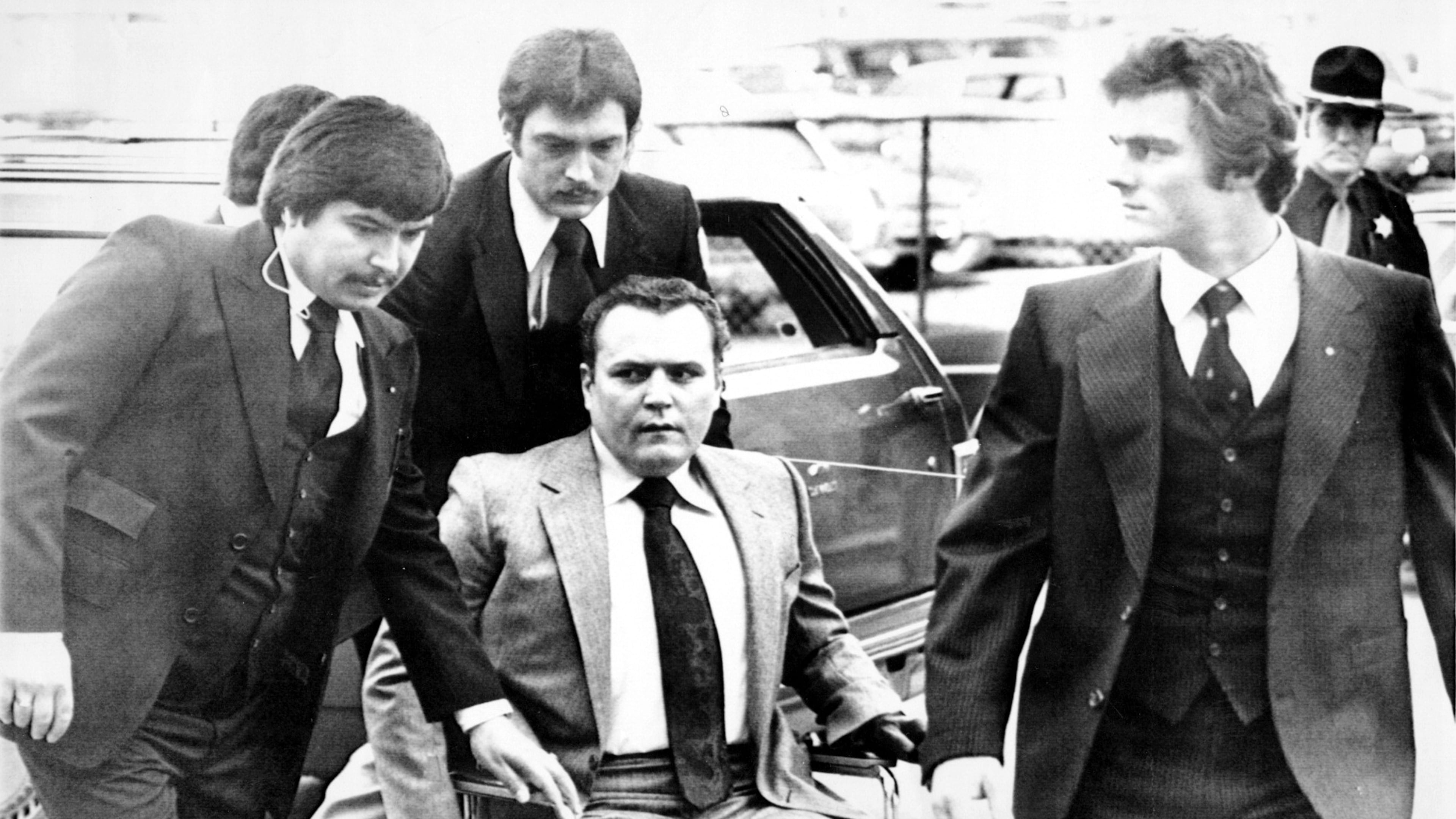 Hustler magazine publisher Larry Flynt is surrounded by heavy security as he arrives March 19, 1979, at the Fulton County Courthouse for the start of his trial on obscenity charges. In June 1984, Joseph Paul Franklin, a self-avowed white supremacist, was indicted by a Gwinnett County grand jury and charged with aggravated assault in the 1978 shootings of Larry Flynt (above) and Gene Reeves (not pictured). Flynt was left paralyzed from the waist down by the attack; Reeves recovered and went on to become a judge in Gwinnett County. Franklin, a serial killer who may have killed up to 22 people, was executed by lethal injection in Missouri in November 2013. Reeves died in July 2015 at age 85.