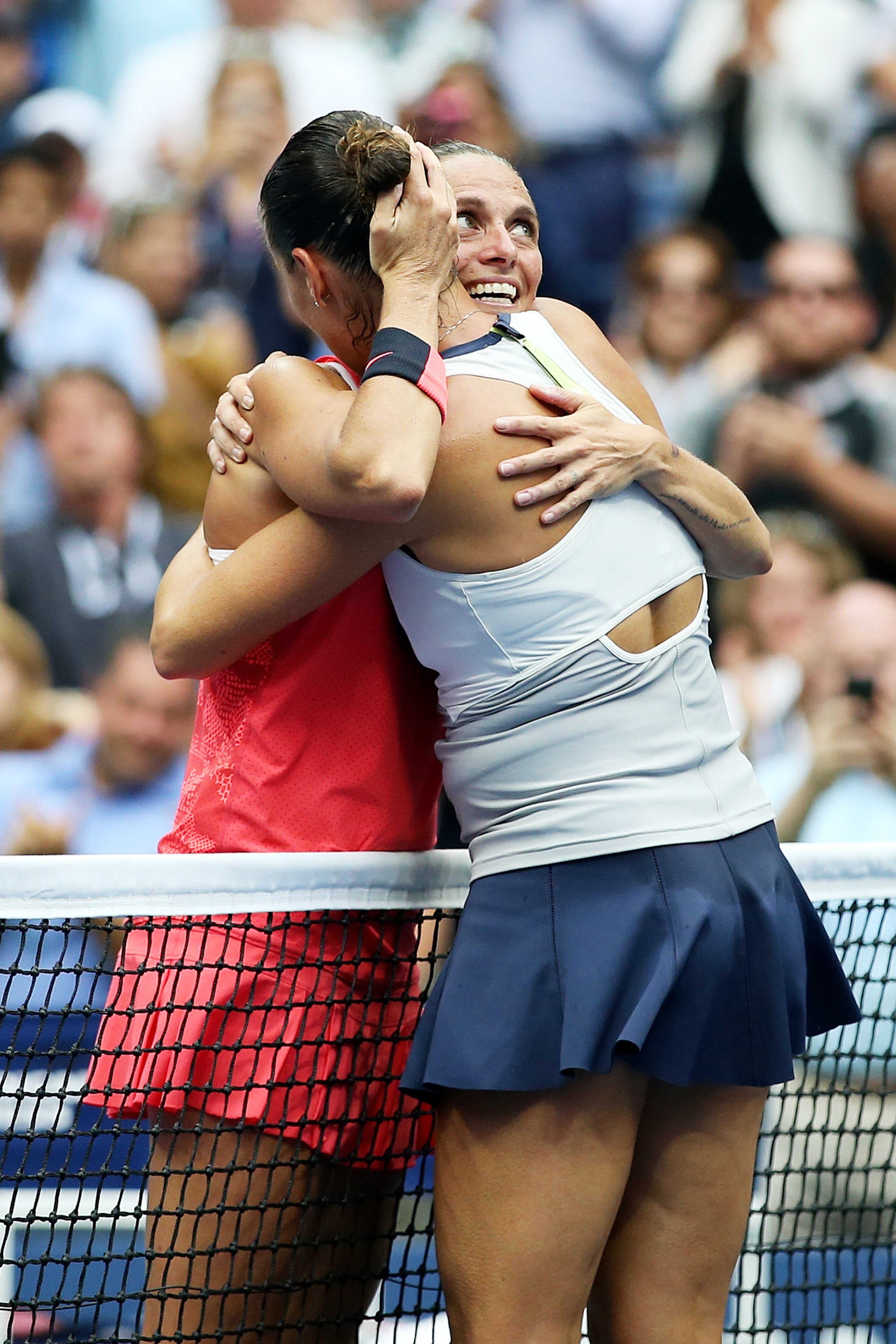 NEW YORK, NY - SEPTEMBER 12: Flavia Pennetta (R) of Italy hugs Roberta Vinci (L) of Italy during their Women's Singles Final match on Day Thirteen of the 2015 US Open at the USTA Billie Jean King National Tennis Center on September 12, 2015 in the Flushing neighborhood of the Queens borough of New York City. Pennetta defeated Vinci 7-6, 6-2. (Photo by Matthew Stockman/Getty Images)