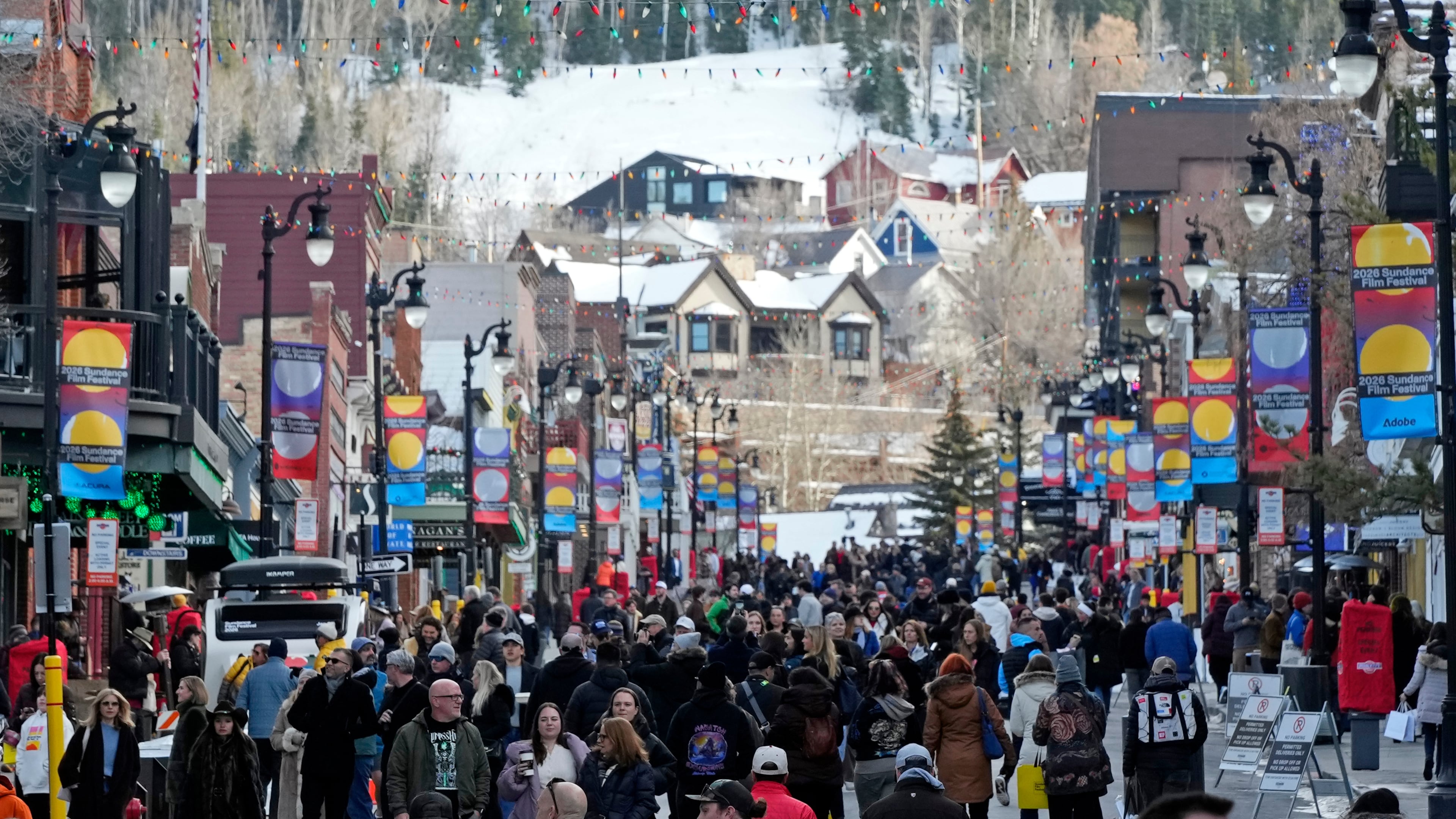 Pedestrians walk down Main Street on the first day of the 2026 Sundance Film Festival on Thursday, Jan. 22, 2026, in Park City, Utah. (Photo by Charles Sykes/Invision/AP)
